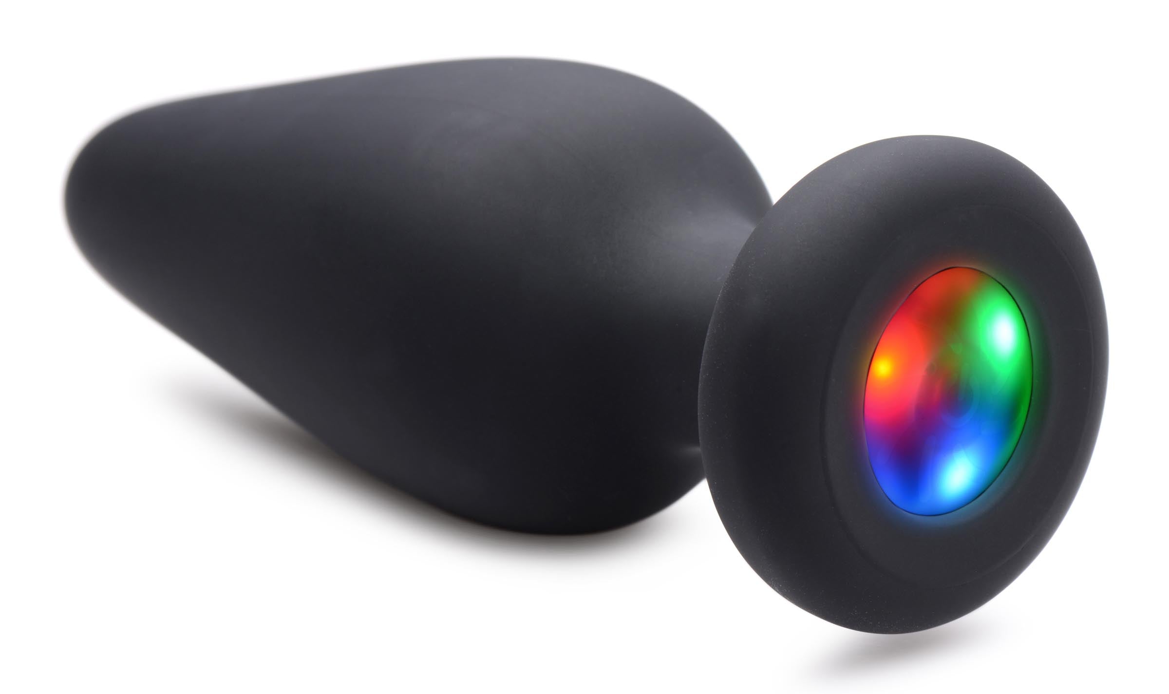 Silicone anal plug with a glowing multicolor light feature