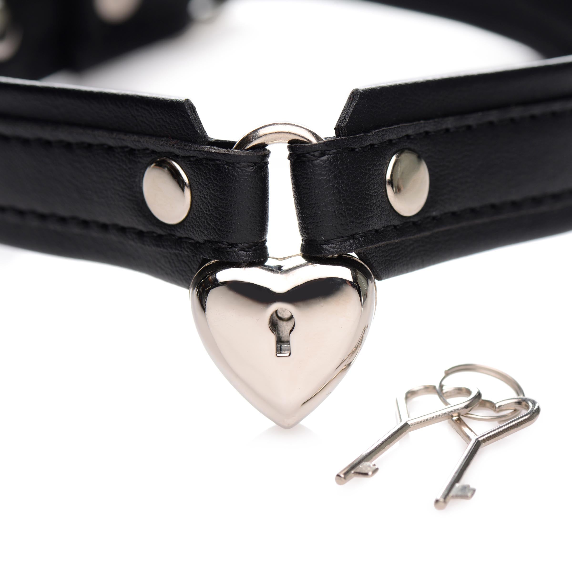 A black leather collar featuring a heart-shaped lock and key