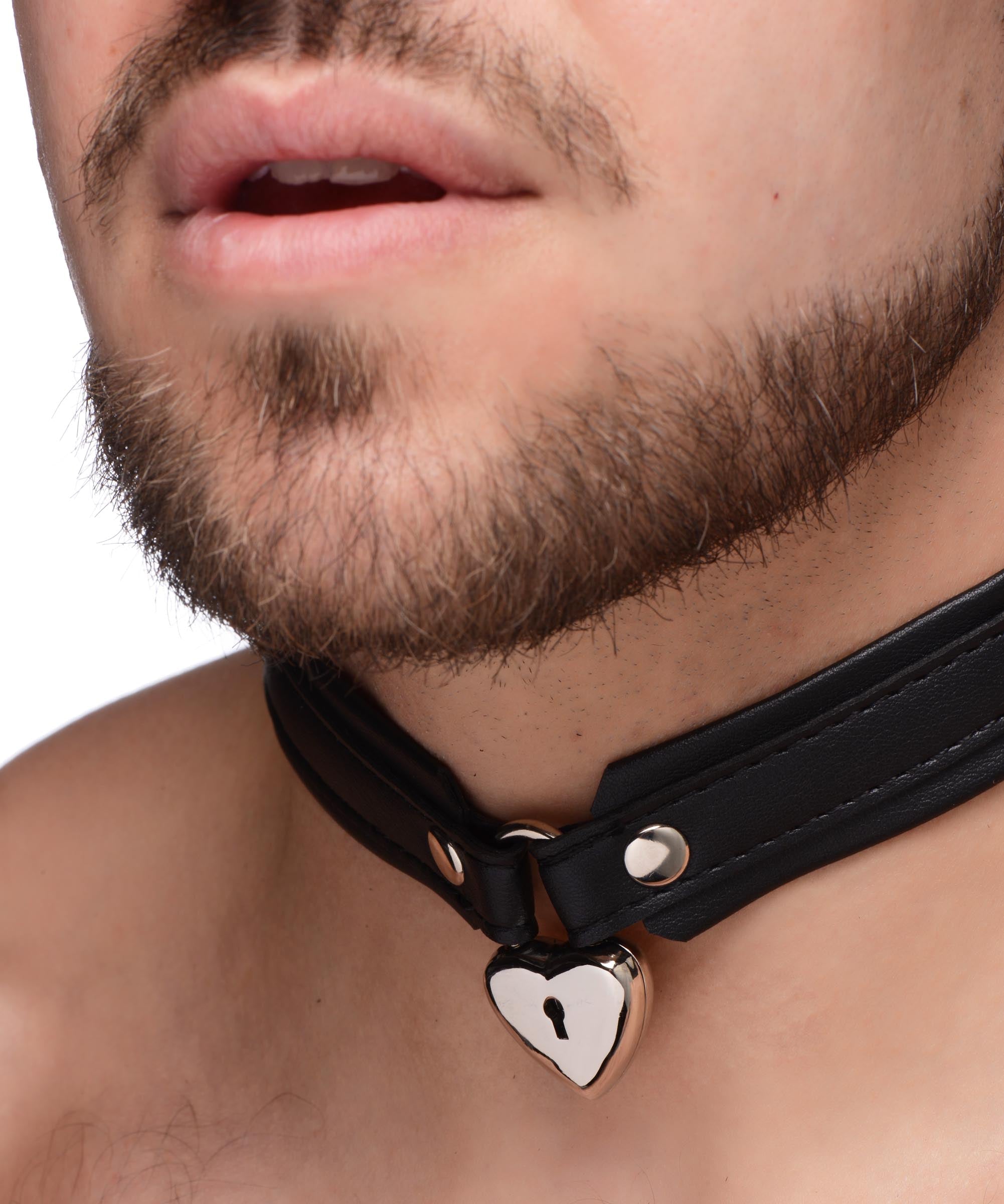 A male model showcasing a black leather collar with a heart-shaped lock