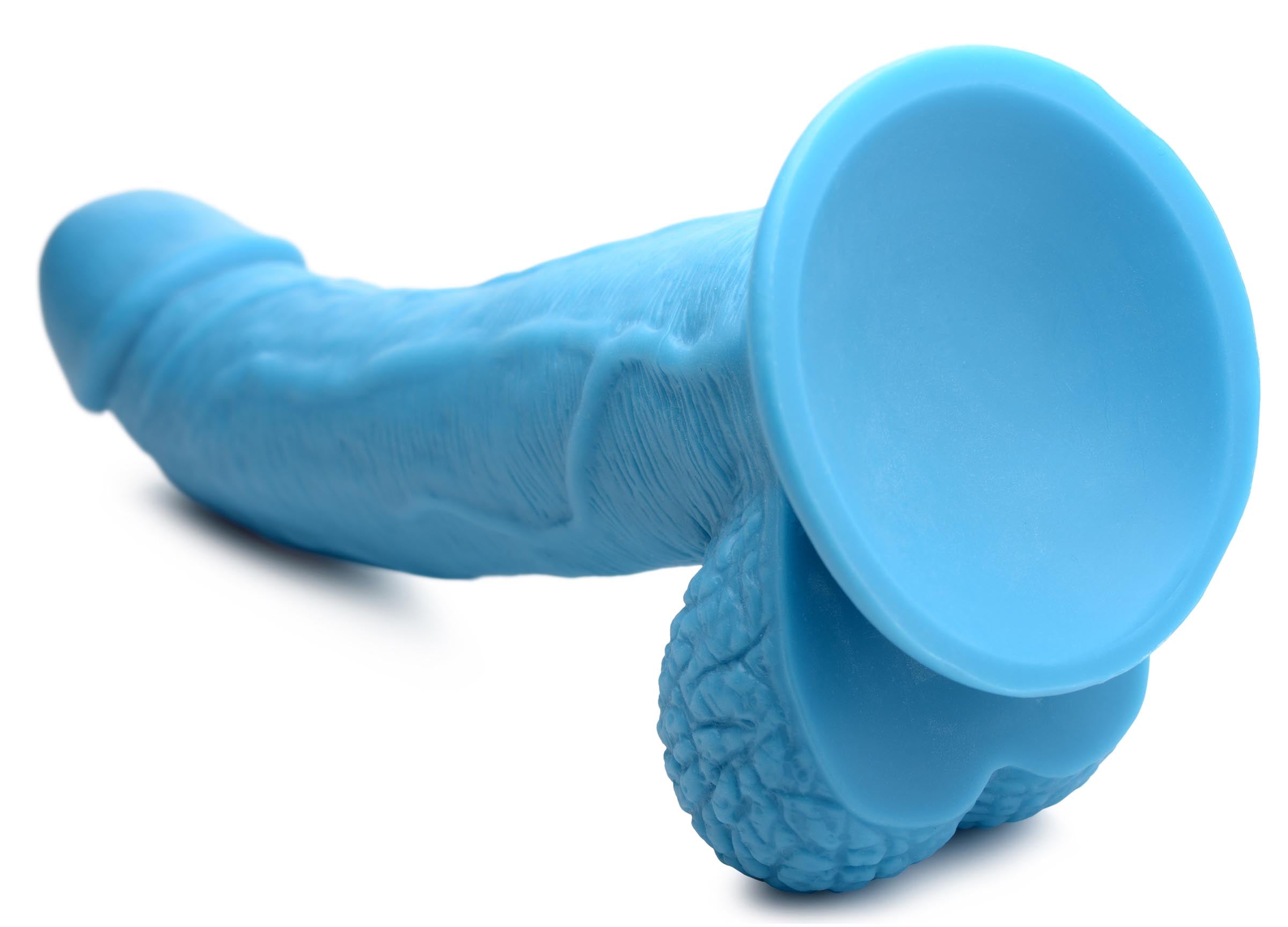 Detailed view of the 7.5-inch blue dildo with a suction cup base