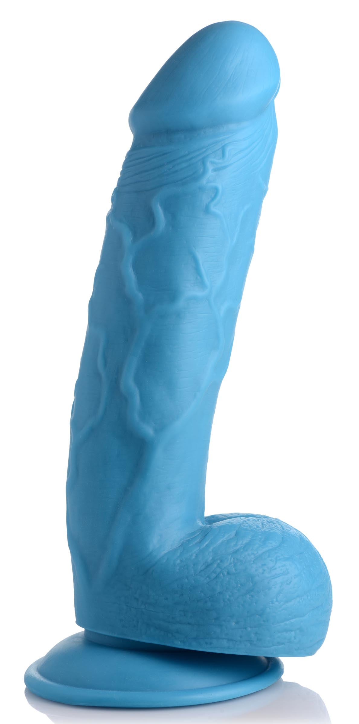 Blue 8.25 inch dildo with balls placed on a white surface