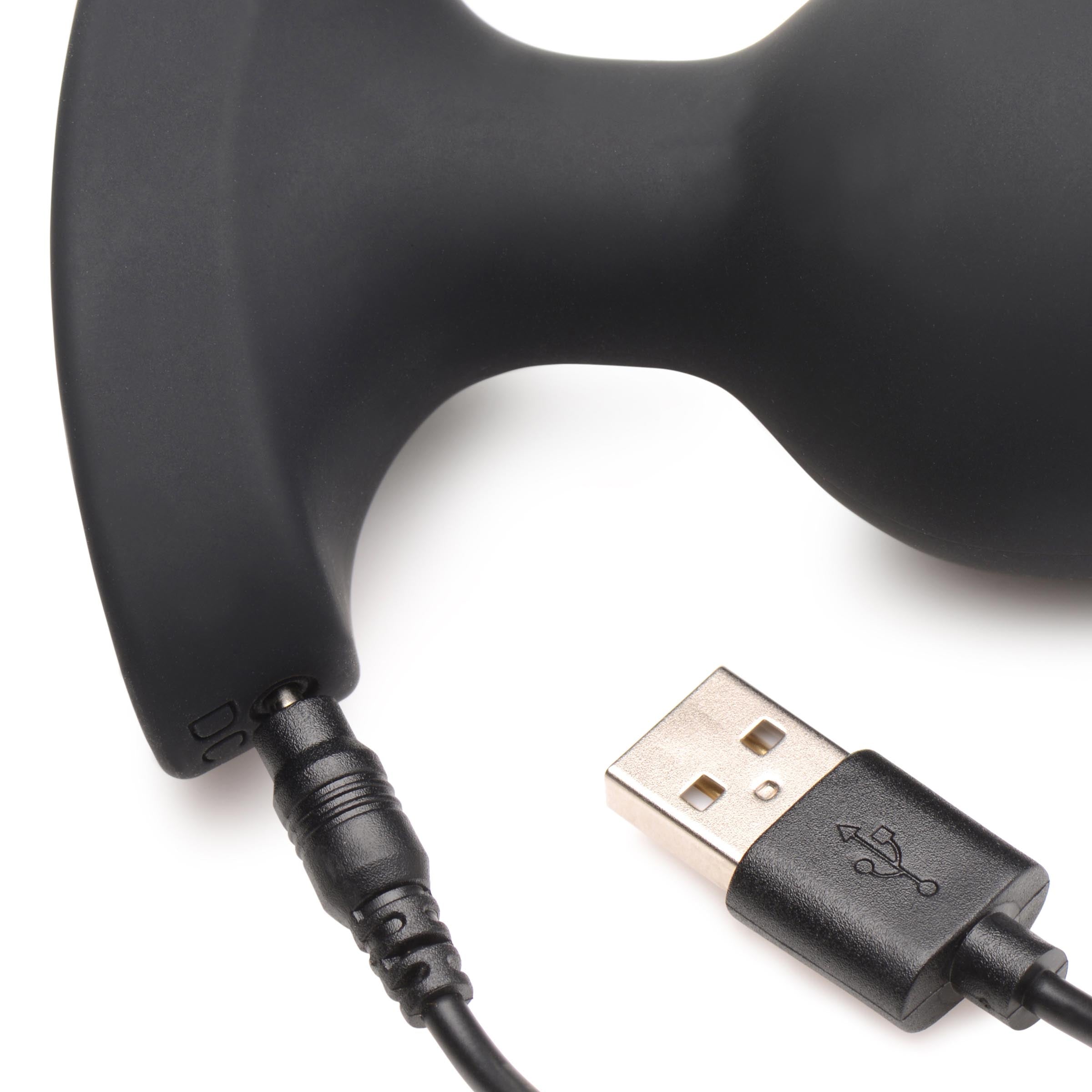 USB charging cable connected to the 28x Laser Silicone Anal Plug