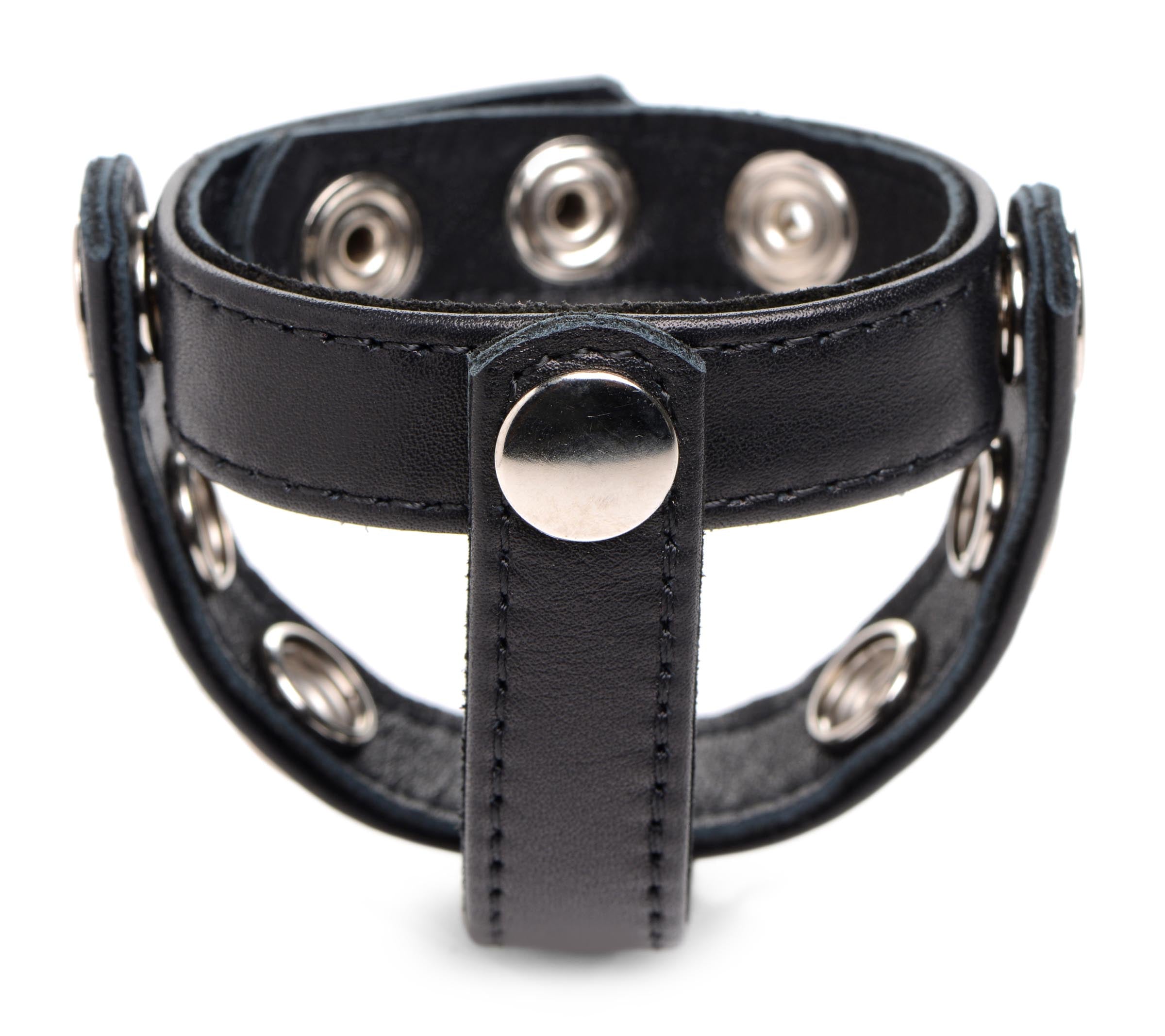 Detail of the black leather snap-on cock harness with metal studs