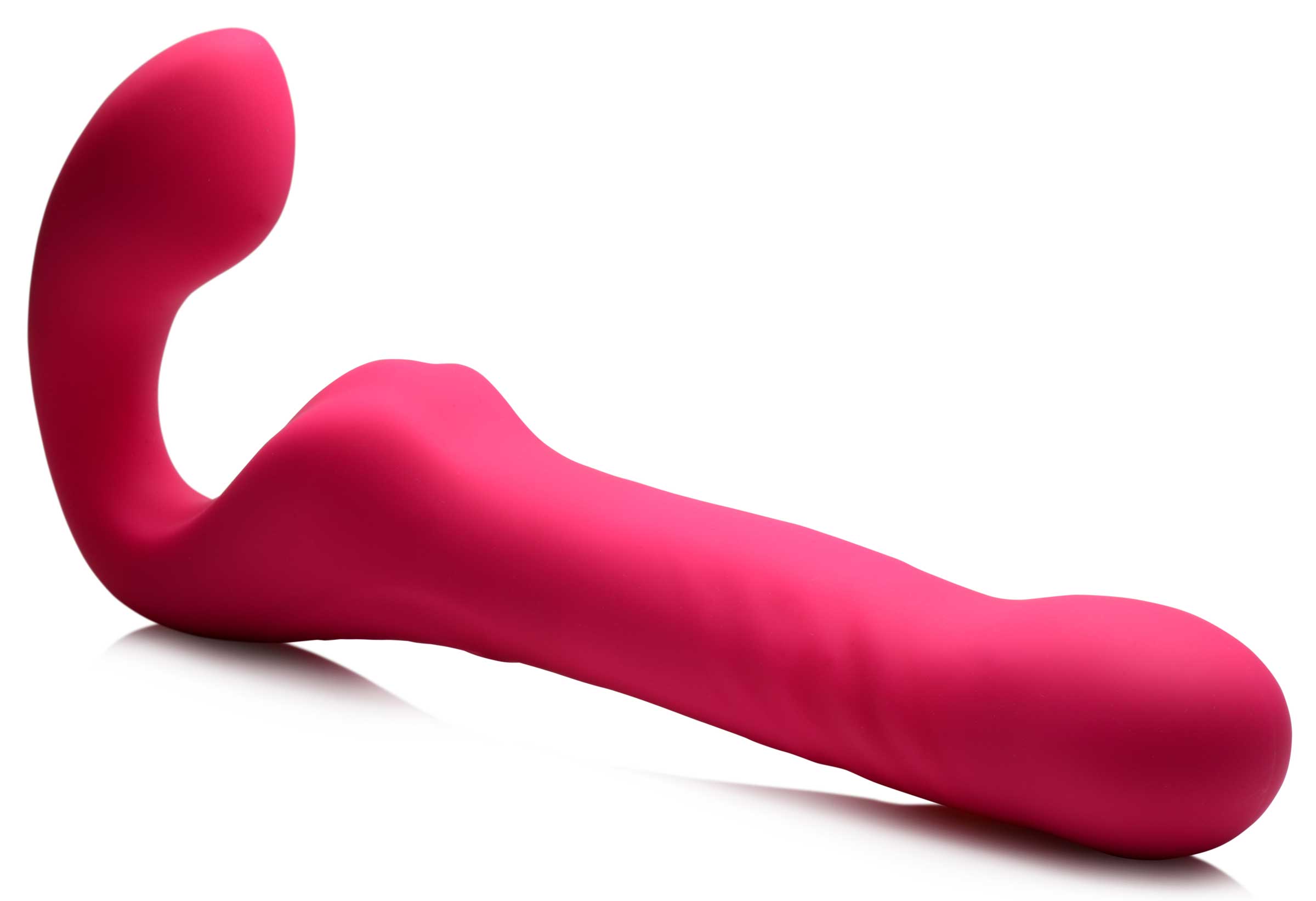 Side view of the pink vibrating and thrusting strapless strap-on on white