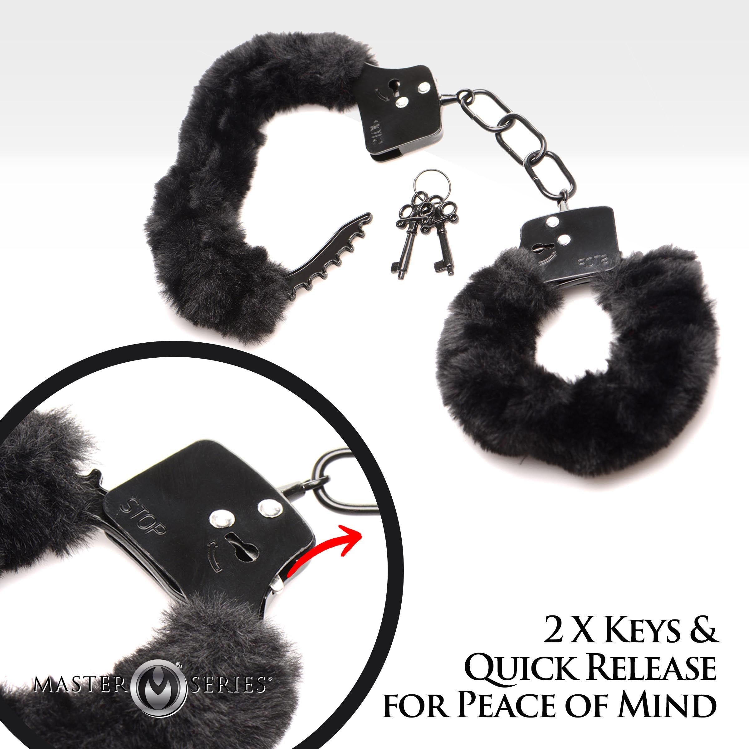 Close-up of furry handcuffs with keys and a metal keychain