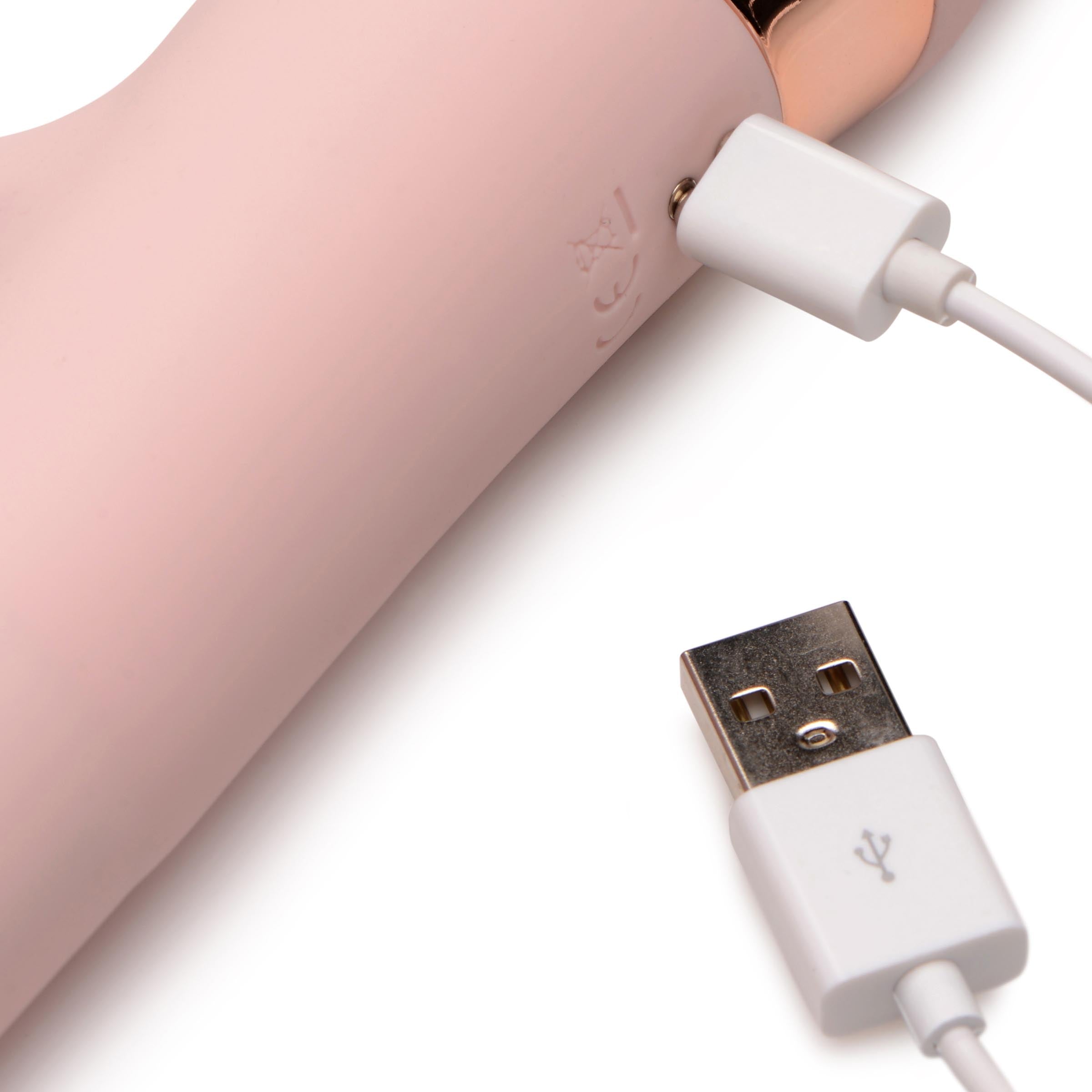 Pink bunny slide ring vibrator charging with a USB cable attached