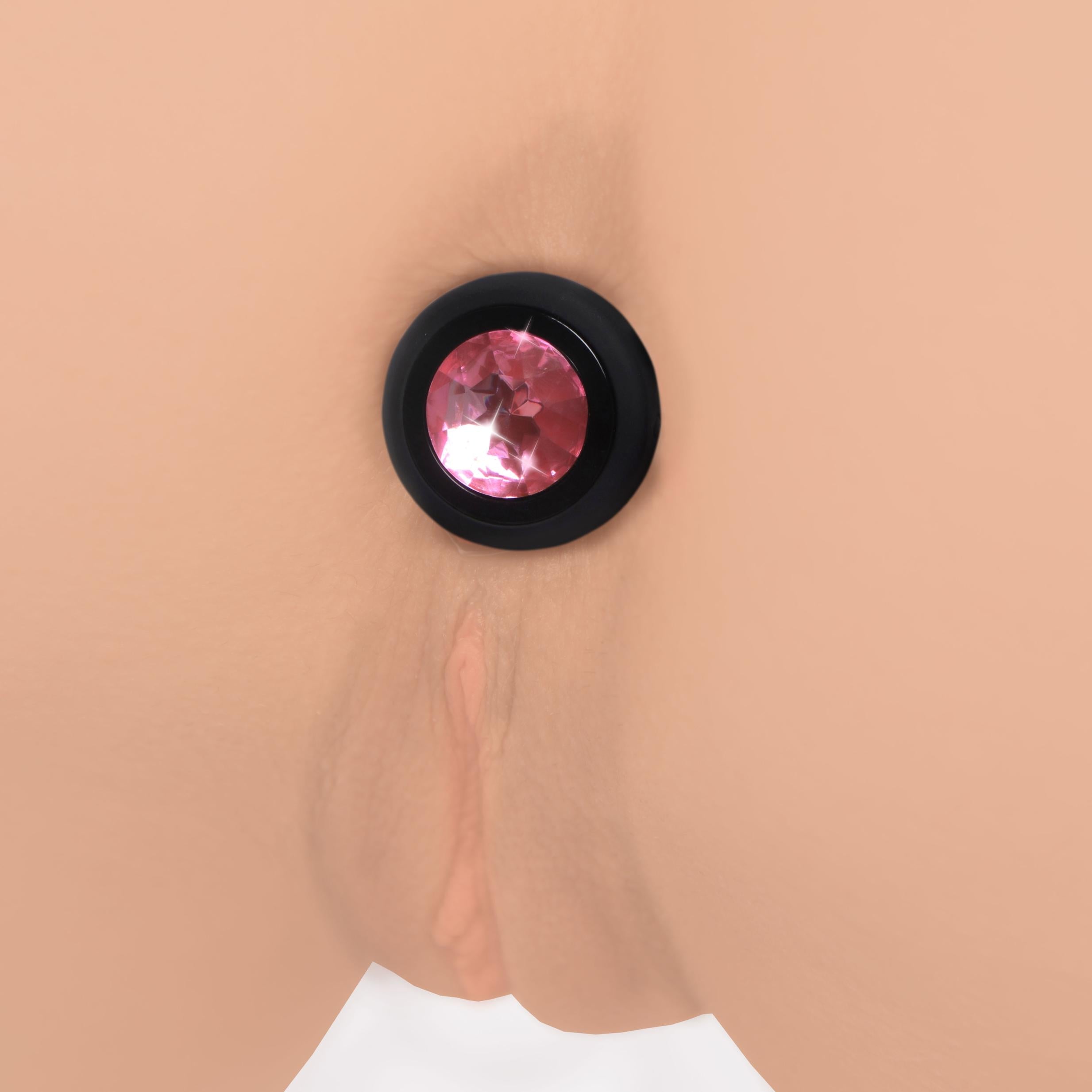 Detail of the pink gem embellishment on the silicone anal plug