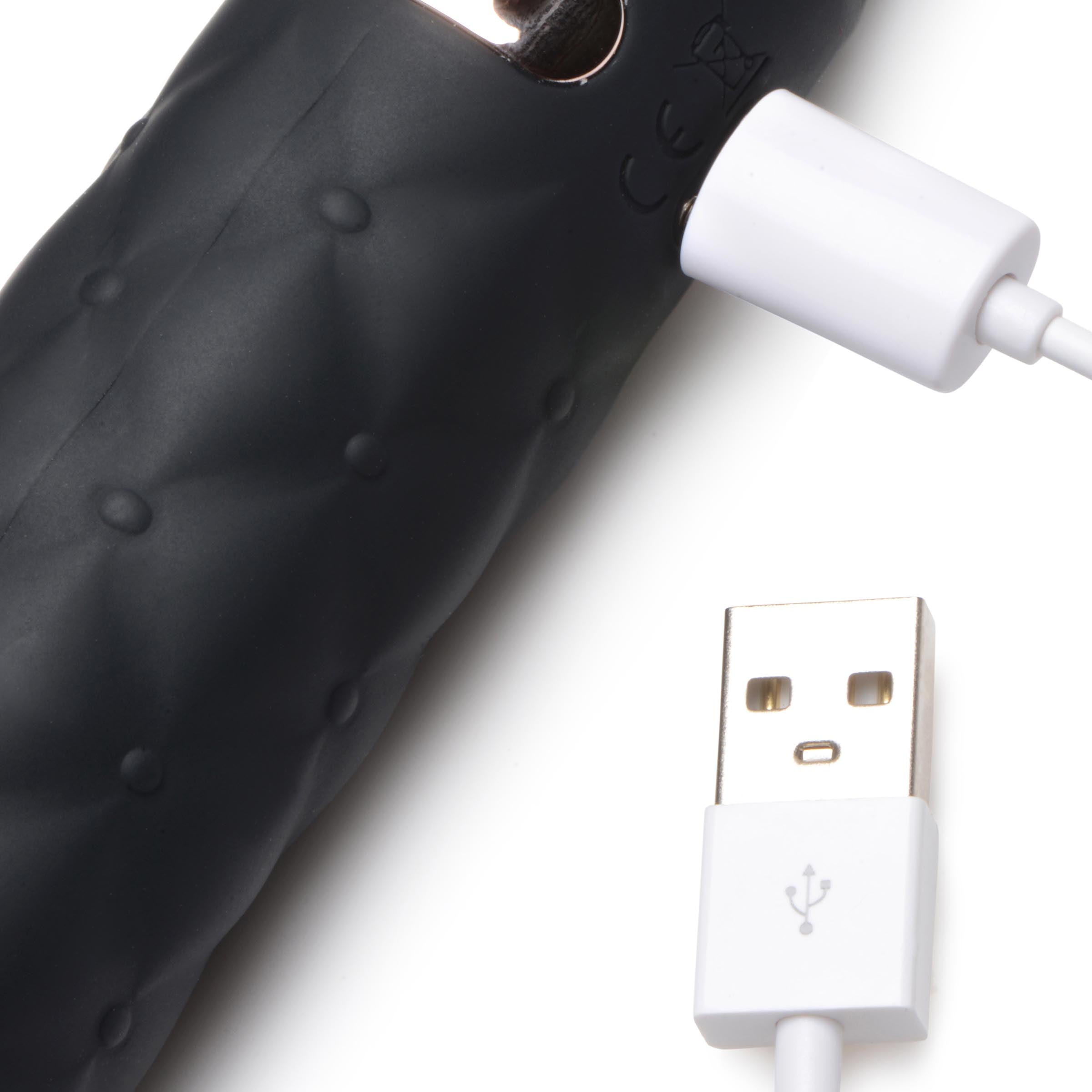 The USB charger for the 9x Vibrating Silicone Dildo Flogger with a white cord