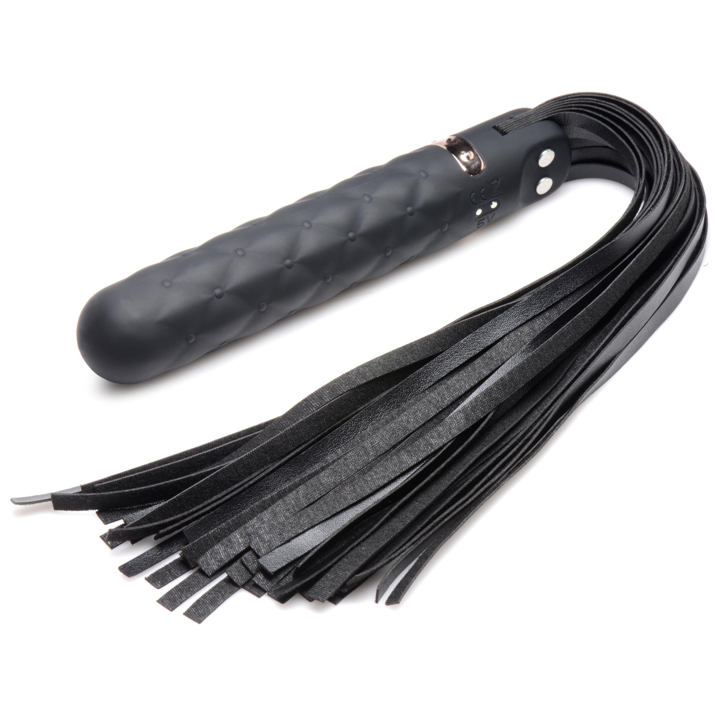 The handle of the 9x Vibrating Silicone Dildo Flogger with a leather grip