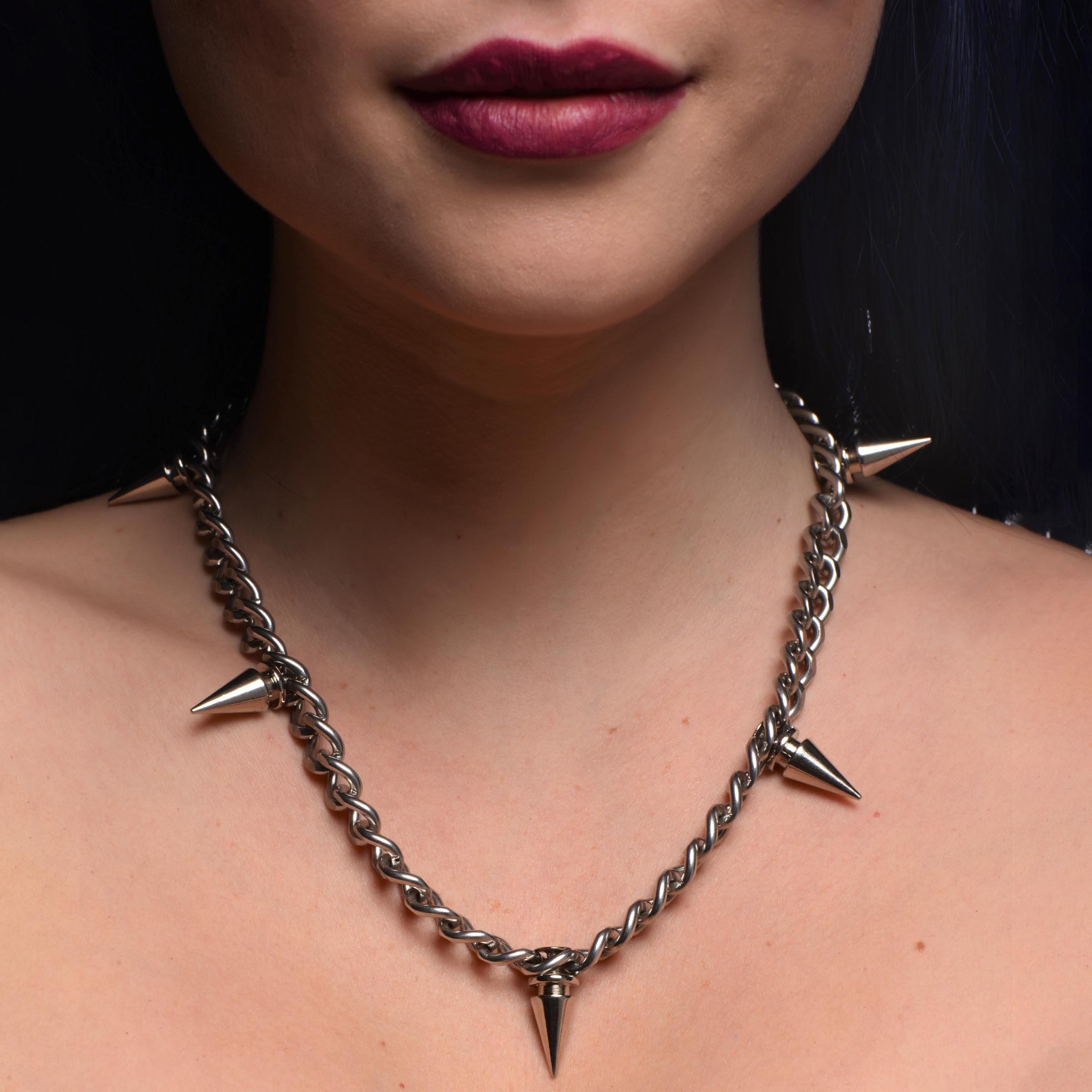 Woman displaying the Spiked Punk Necklace with sharp spikes