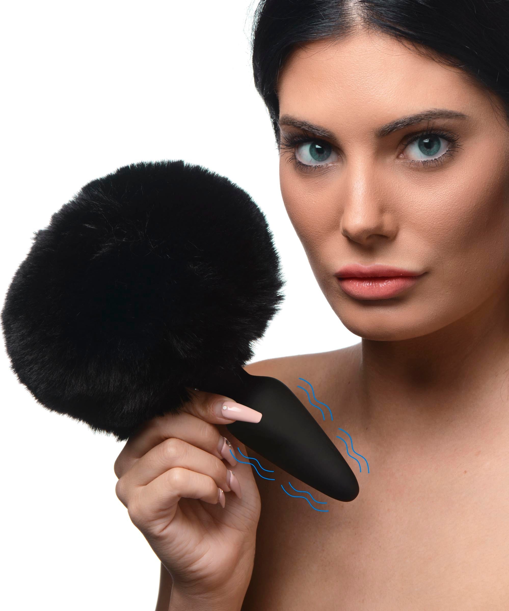 Woman holding the black bunny tail attachment, showcasing its texture