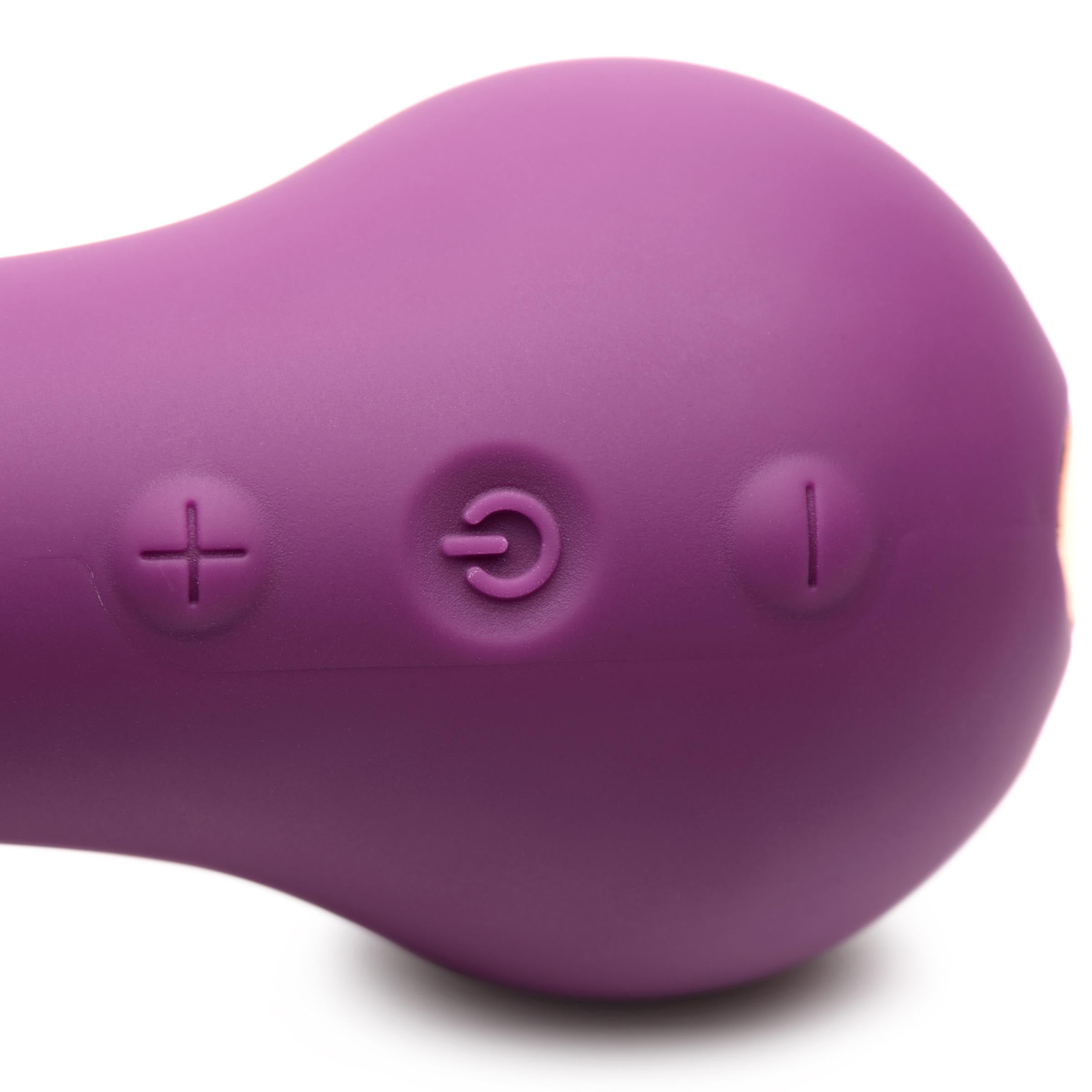 Woman using the purple G-spot vibrator to demonstrate size