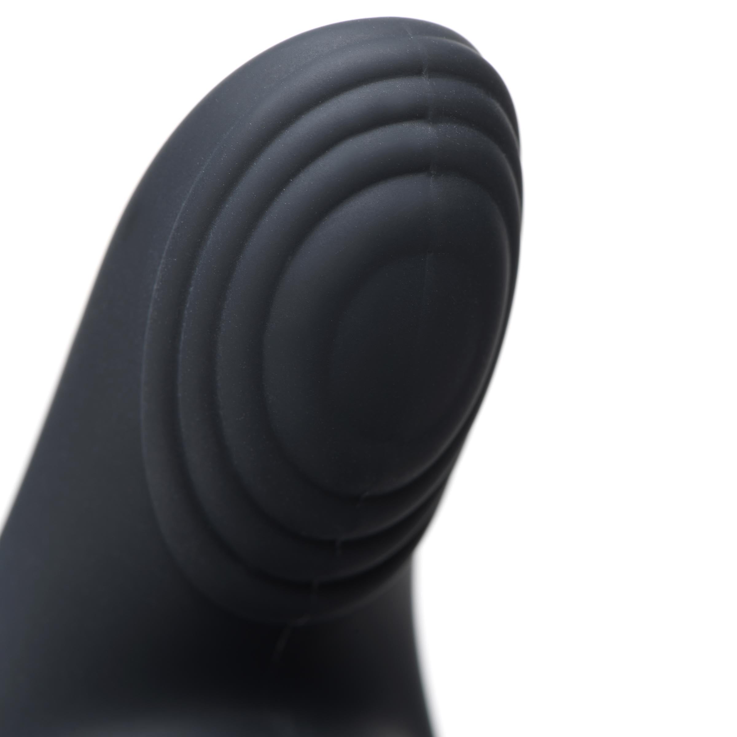 Detailed view of a silicone triple stimulation vibrator against a white backdrop