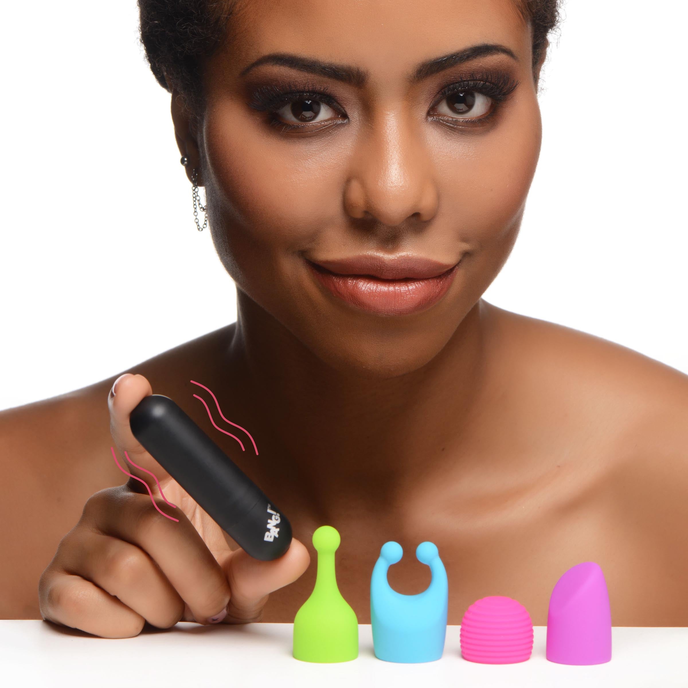 Person displaying the 7x Rechargeable Bullet Vibrator with its four colorful attachments