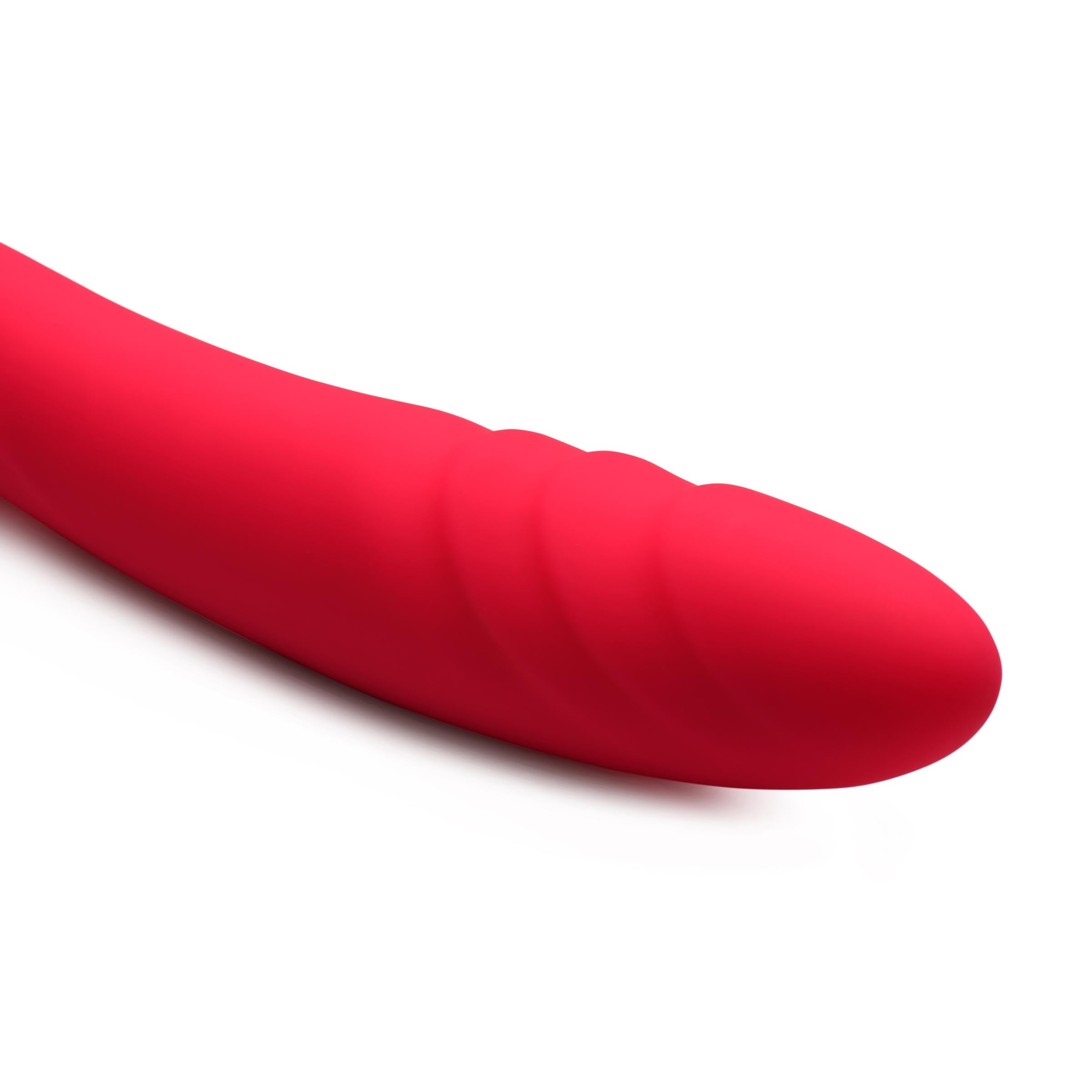 Red double-ended silicone dildo against a white backdrop