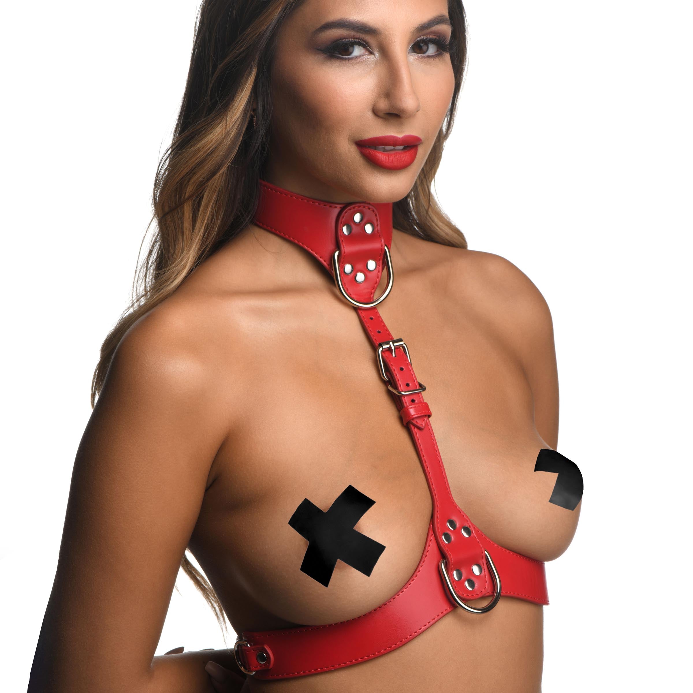 Red leather chest harness displayed on a female model with a cross design