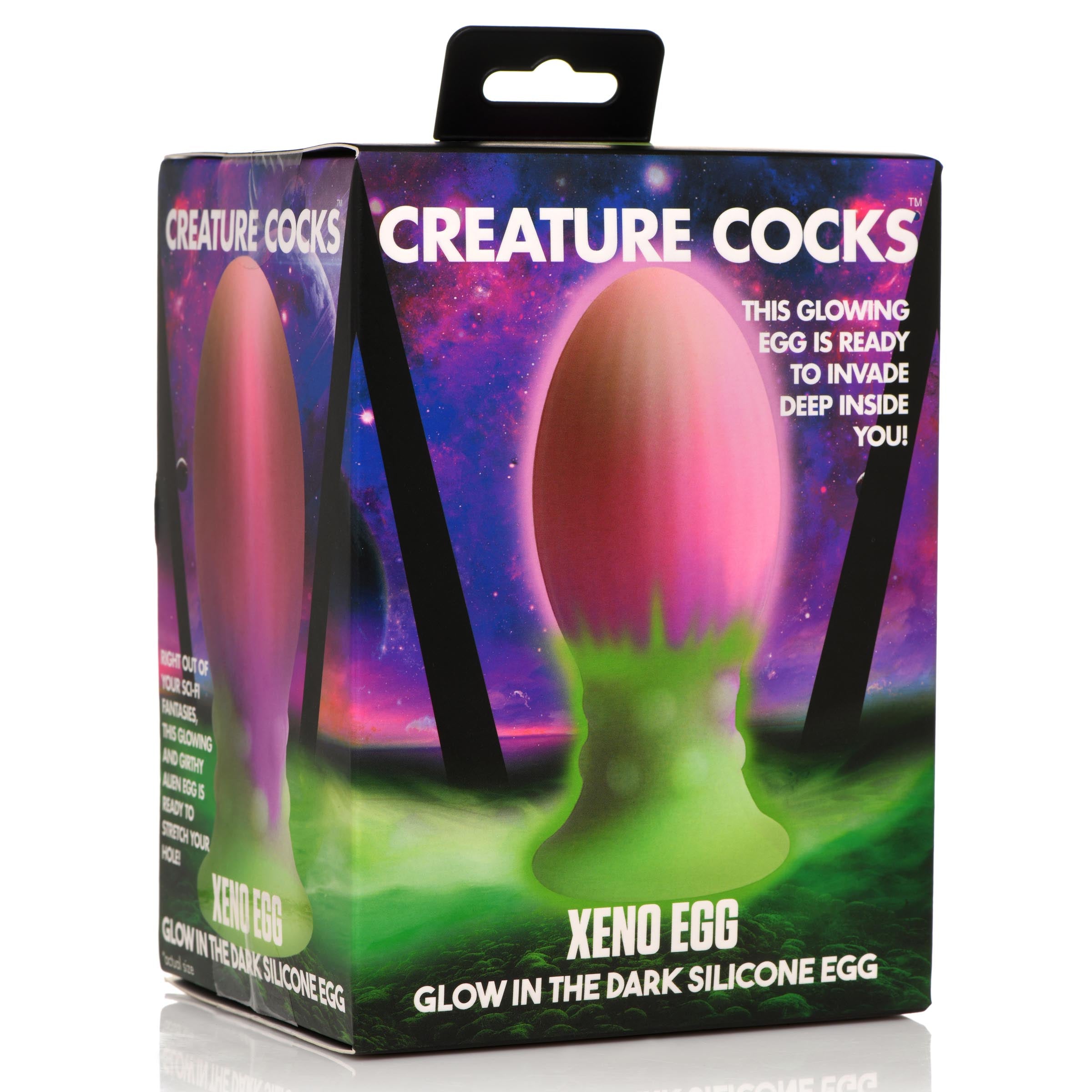 Packaging of the Xeno Egg glow-in-the-dark toy featuring pink and green colors