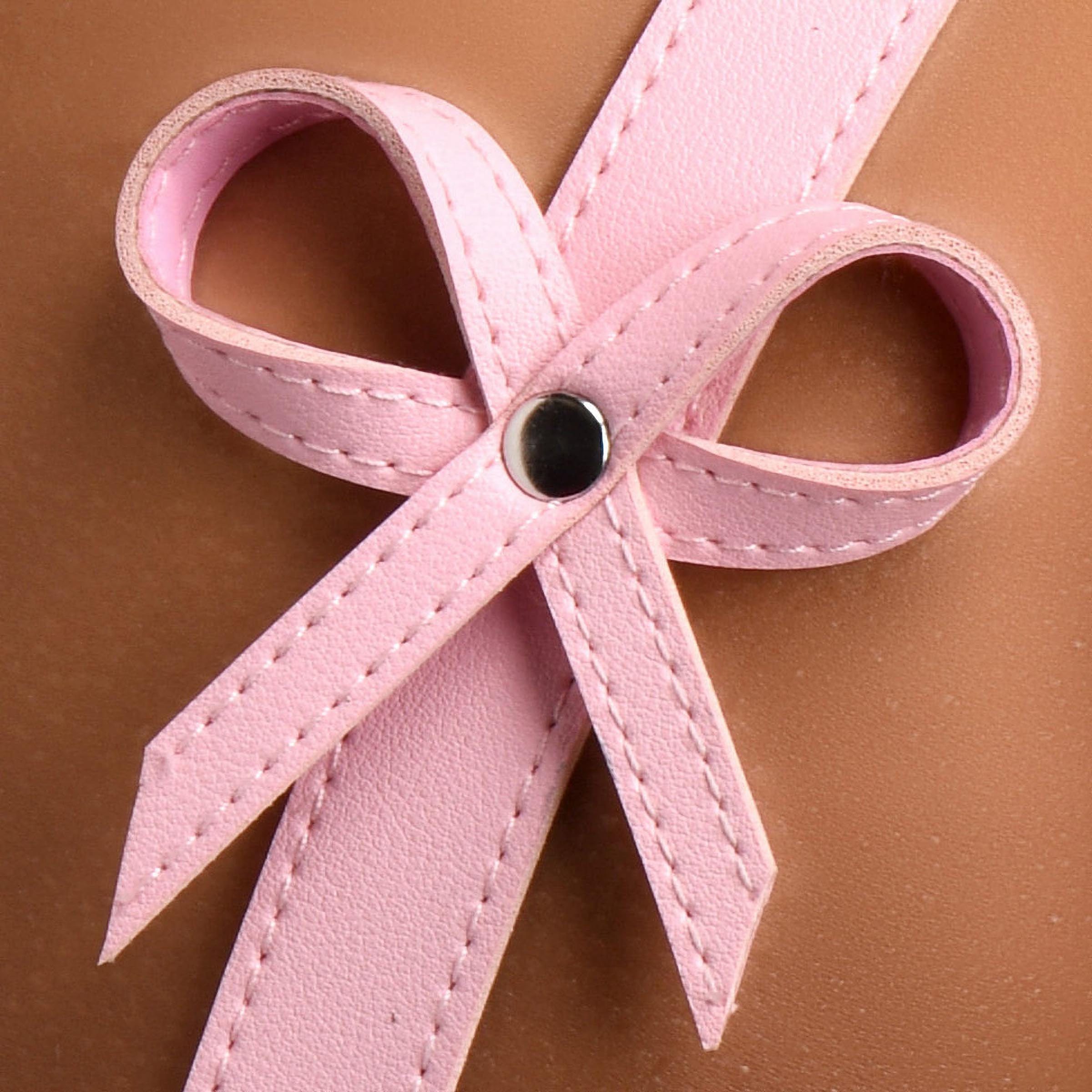 Pink bow detail on the Pink Bondage Thigh Harness