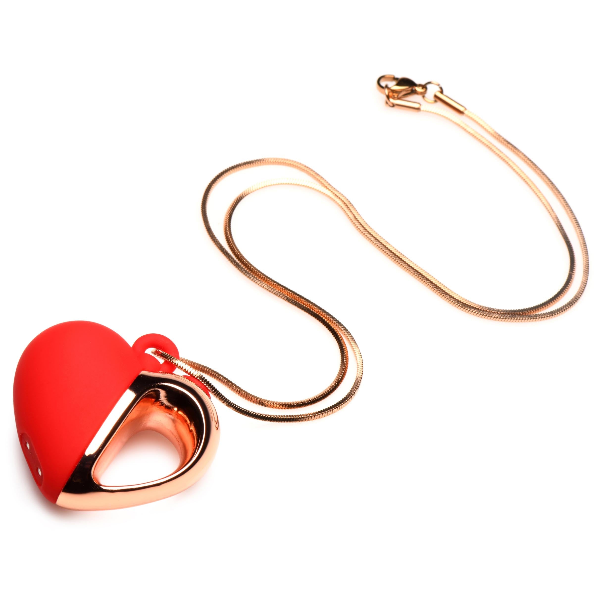 Close-up of the silicone heart pendant on a delicate gold-tone chain