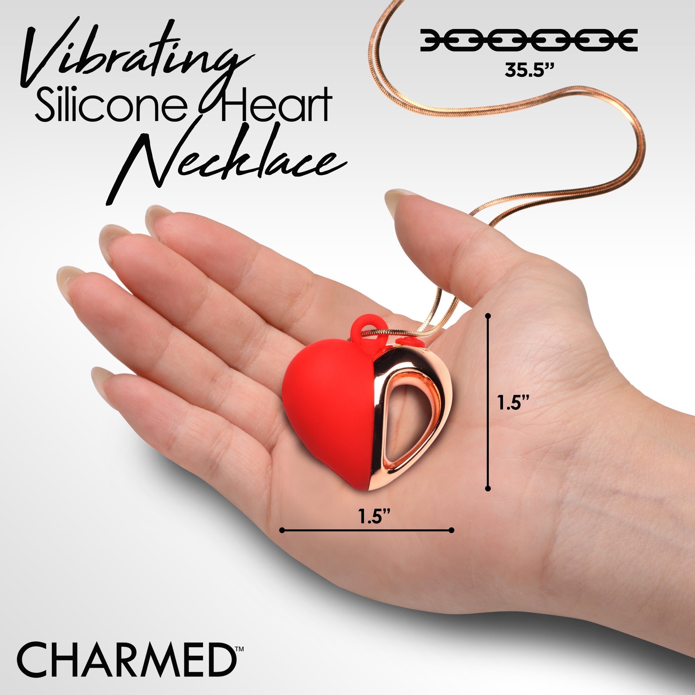 Close-up of a woman's hand holding the vibrating silicone heart pendant