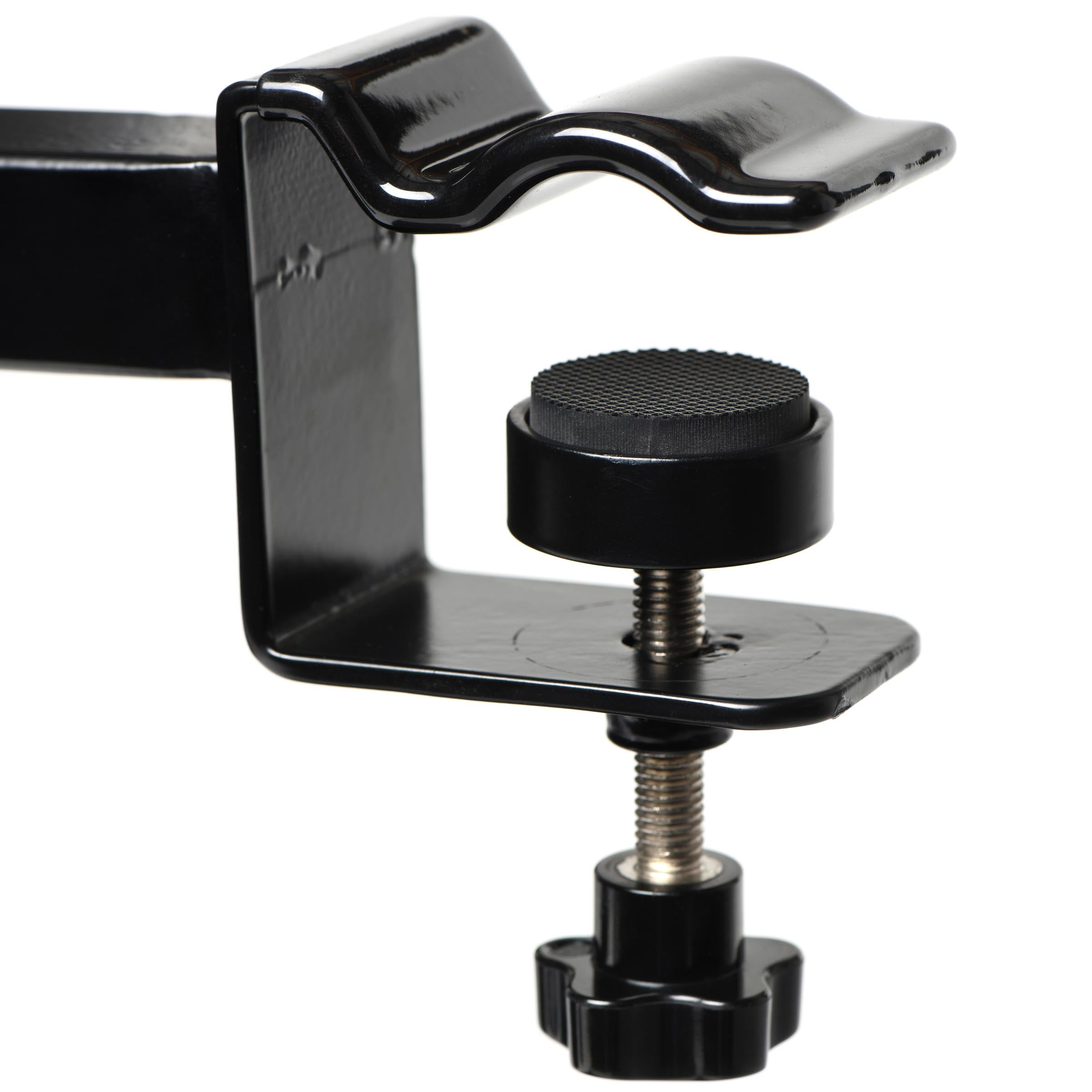 Close-up of black fastening clamp with adjustment tools