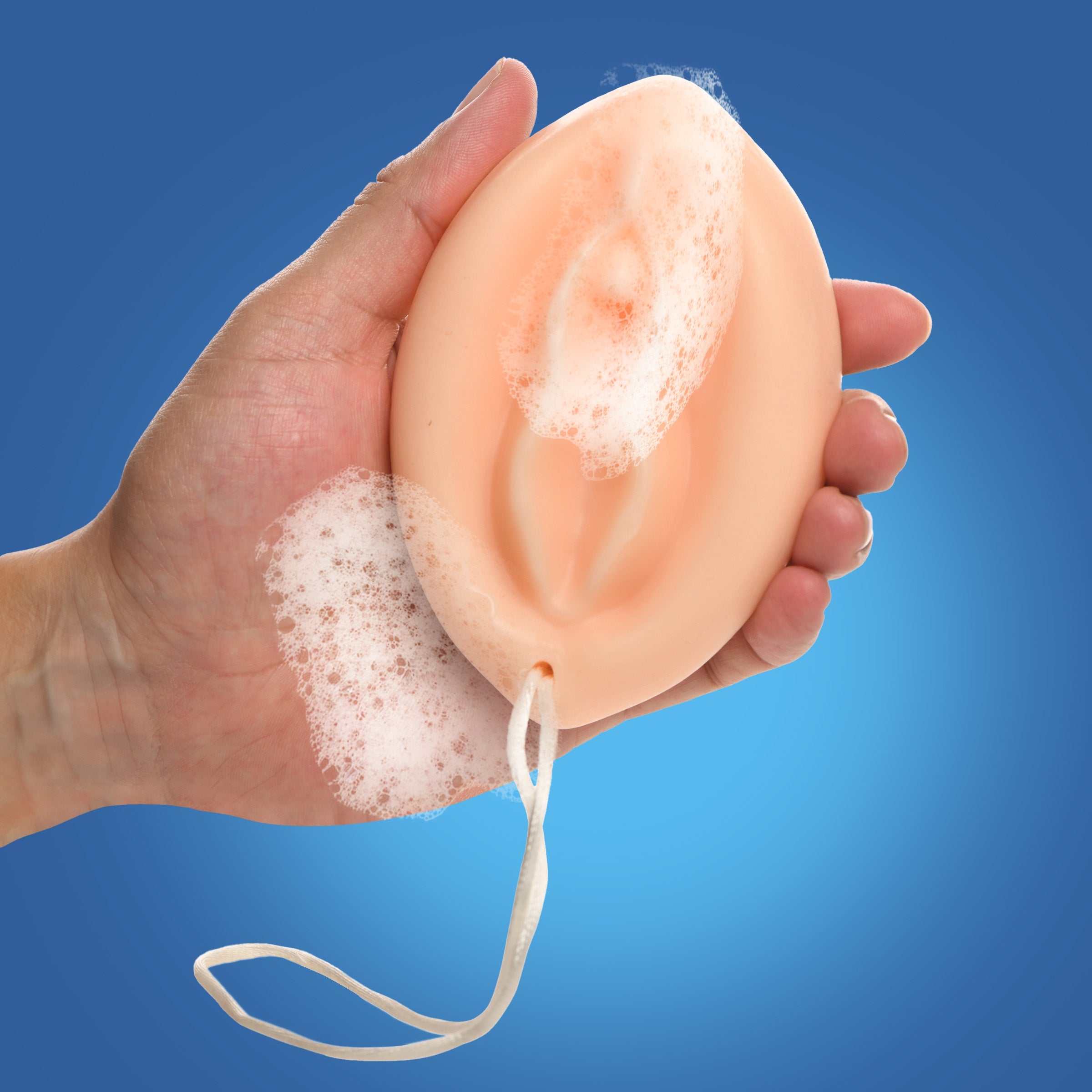 A person holding the Pussy Soap on a Rope product