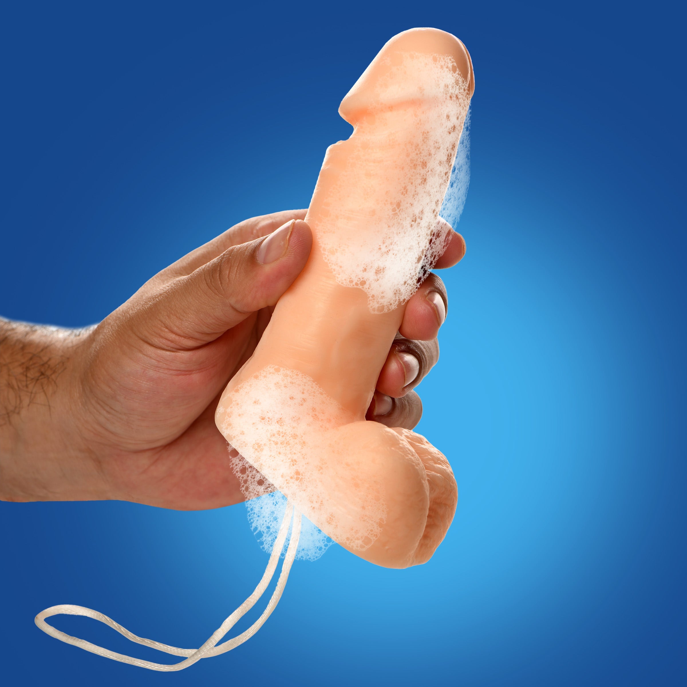 Close-up of the Pecker Cleaner Soap on a Rope held in a person's hand