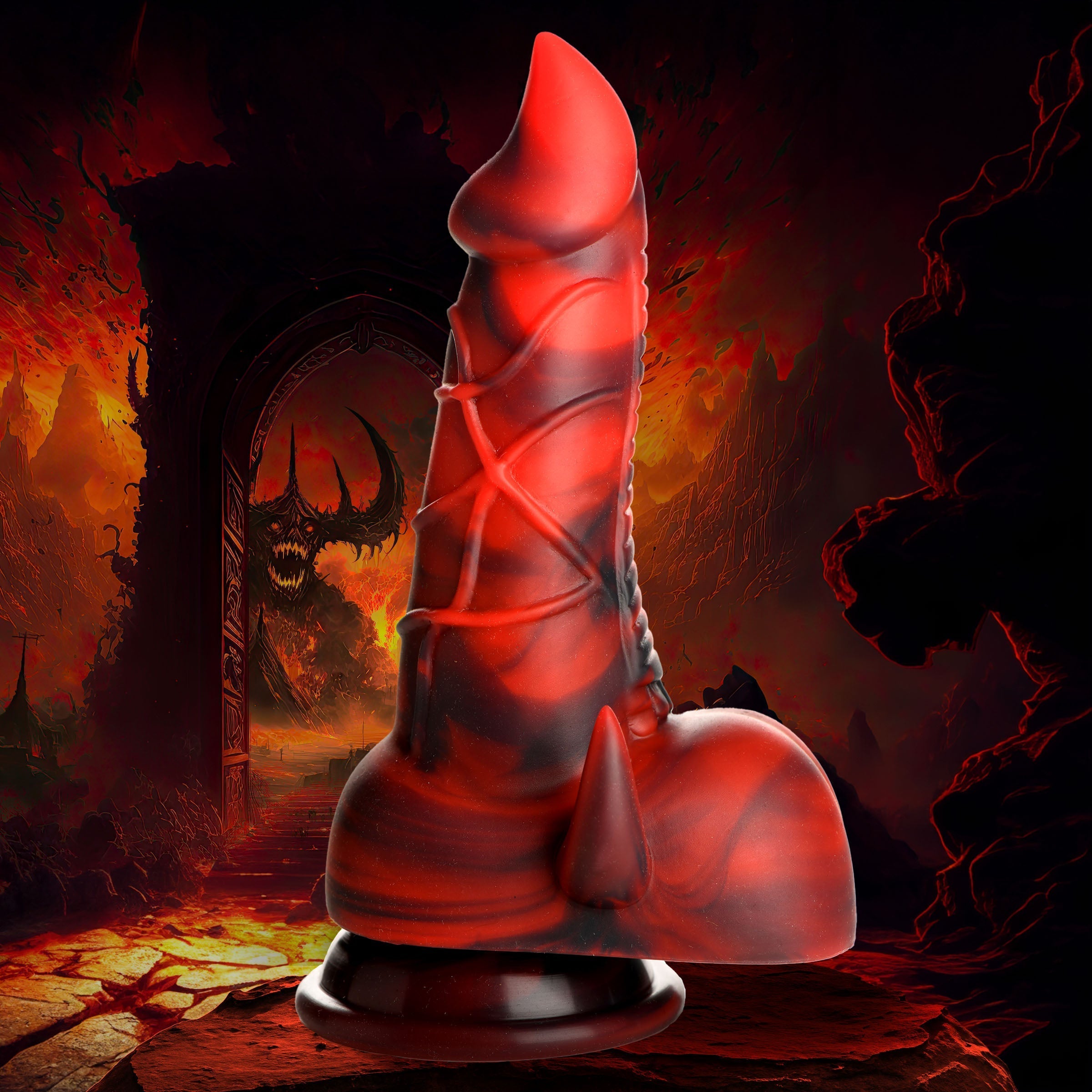 Close-up of a red and black silicone dildo featuring a demon motif