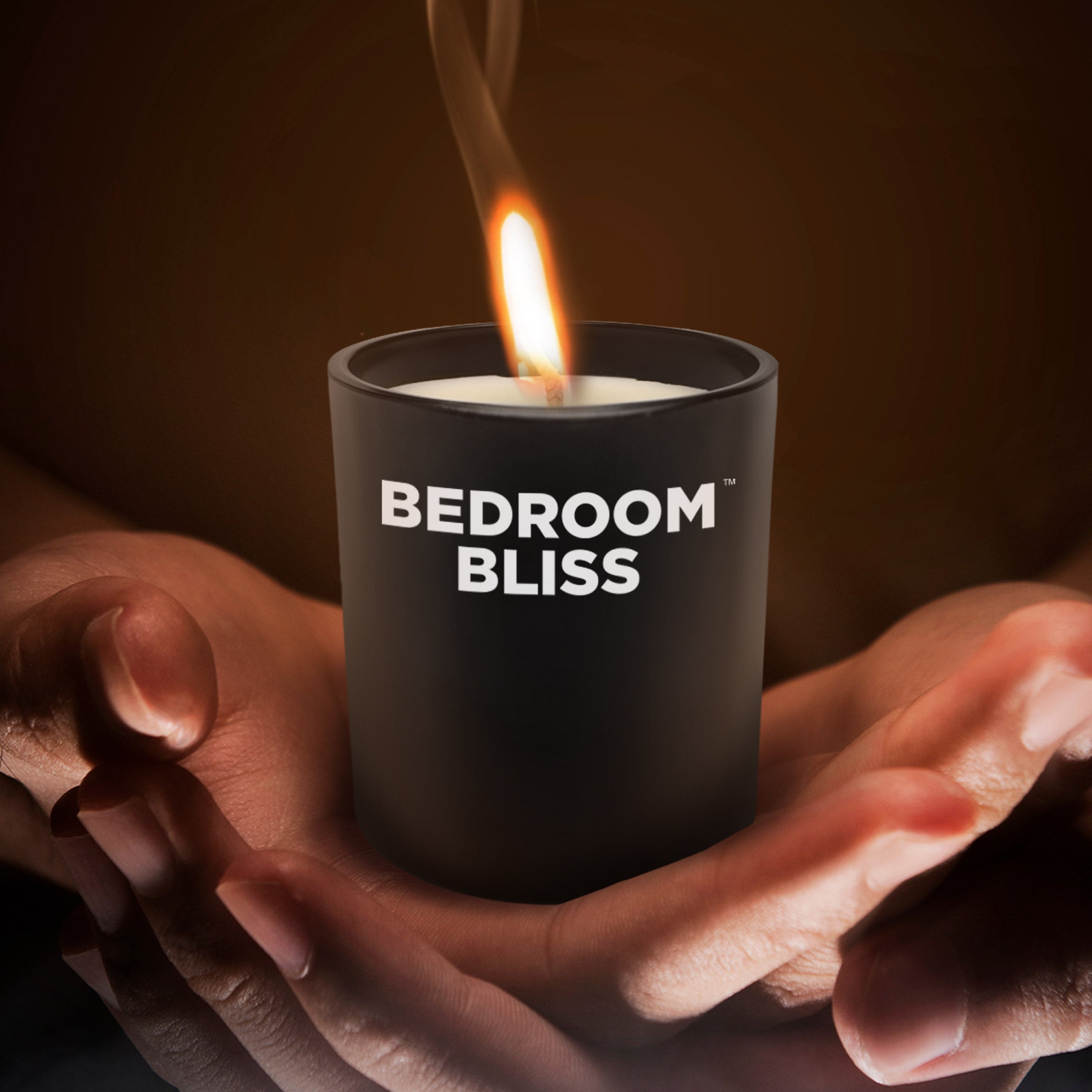 Vanilla-scented Lover's Massage Candle in a cozy bedroom setting