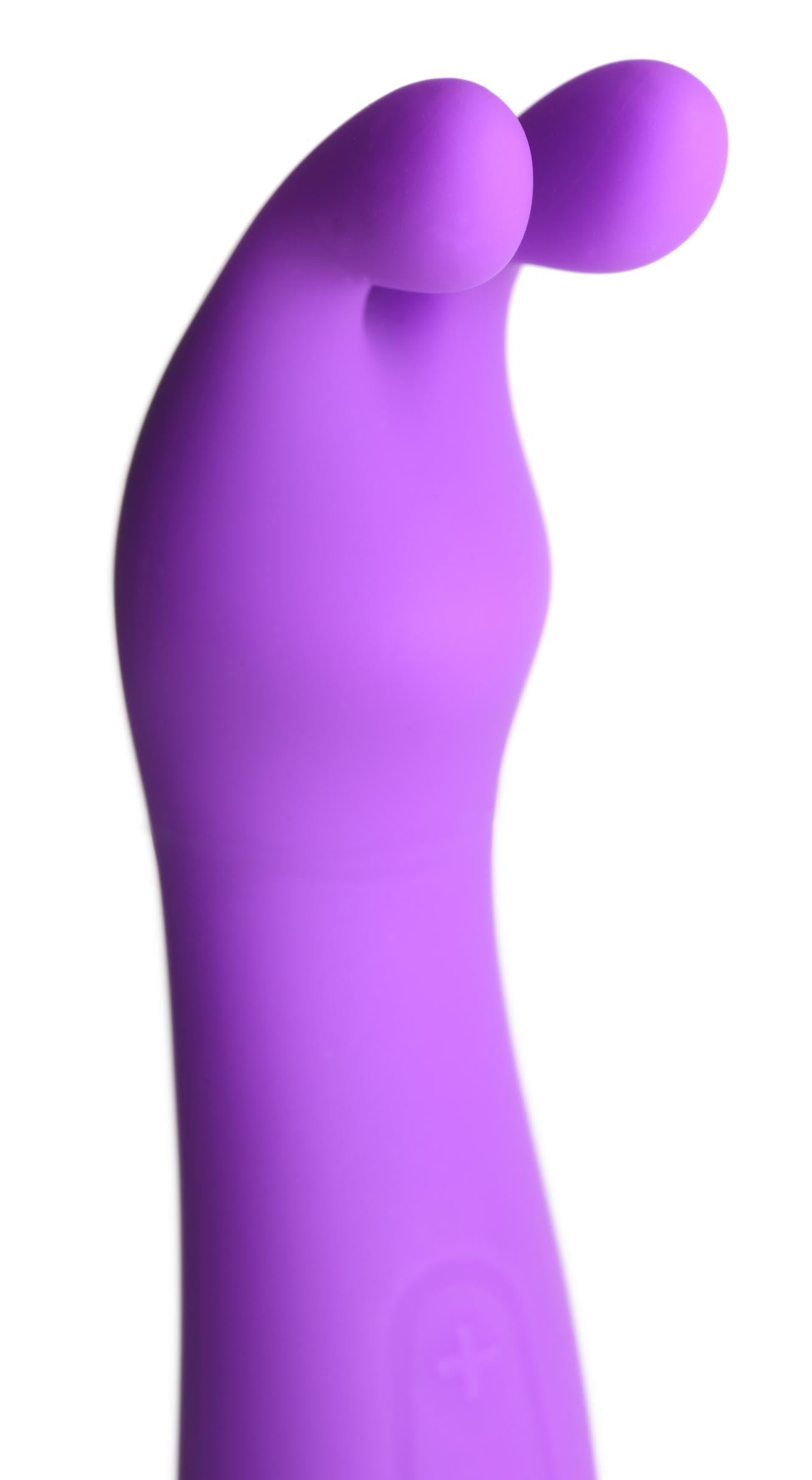 Hand holding the Zippy Silicone Rabbit Vibrator in purple