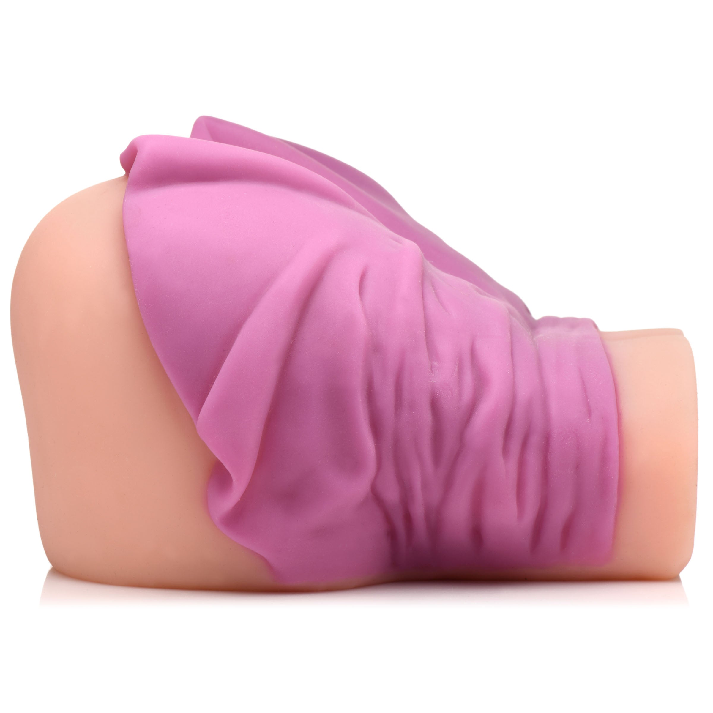 Lifelike adult novelty with a pink hue and draped in a purple cloth