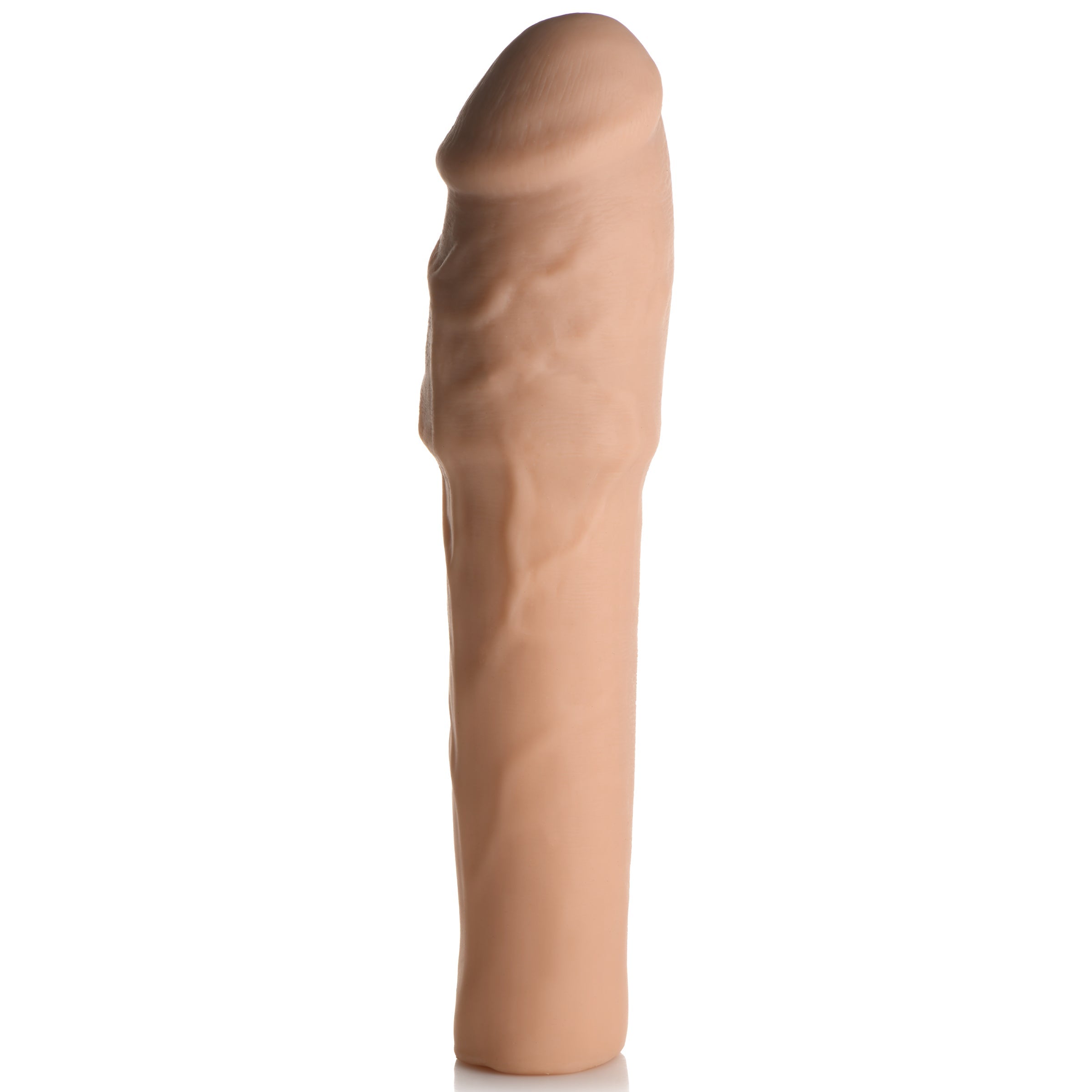 A thick 2-inch penis extension displayed against a white backdrop