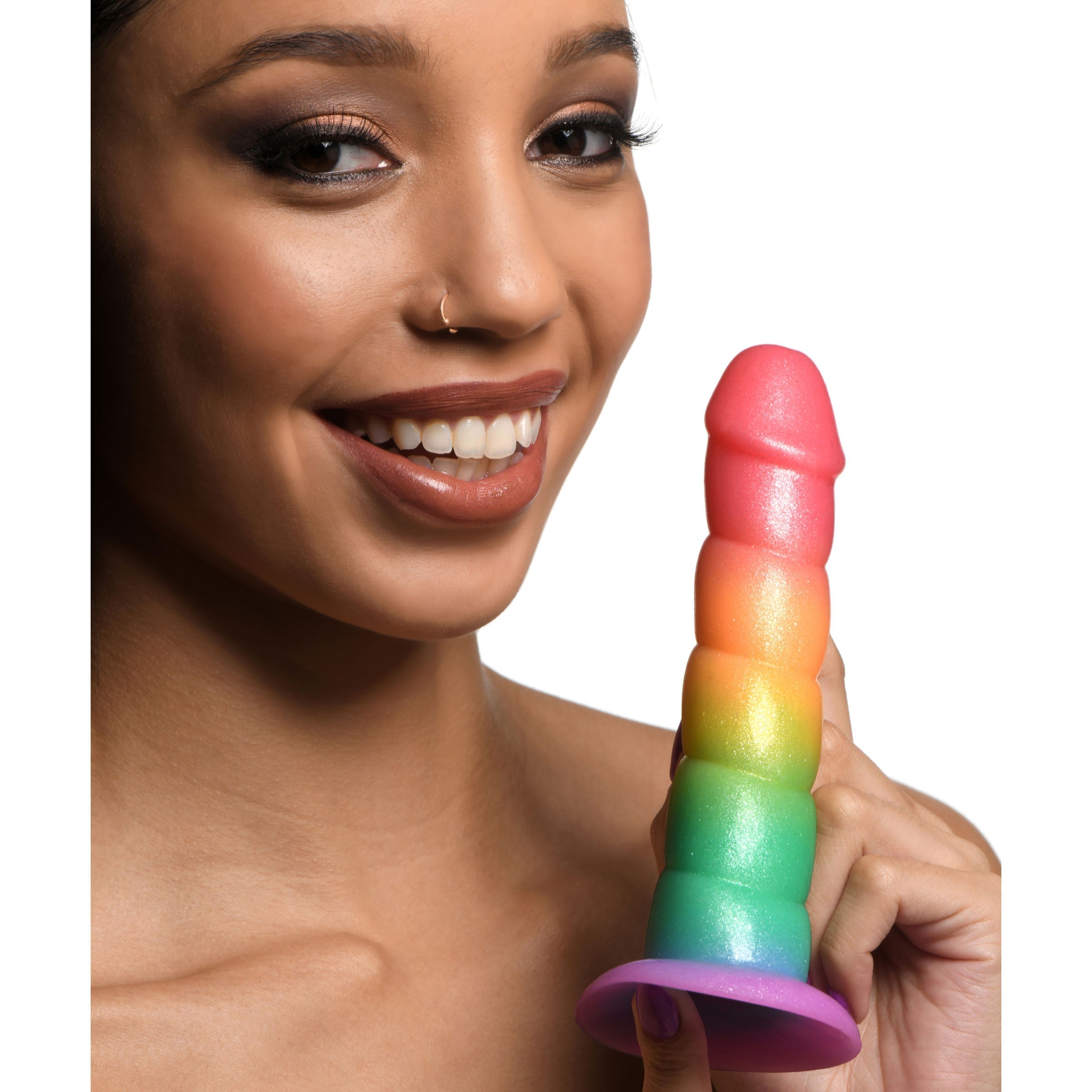 Woman demonstrating how to hold a rainbow-colored swirl pattern silicone dildo