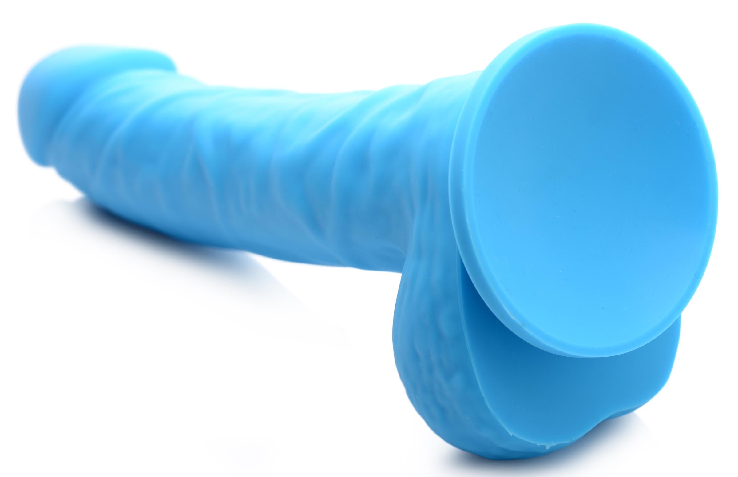 Side view of a 7-inch silicone dildo with balls showing the shaft