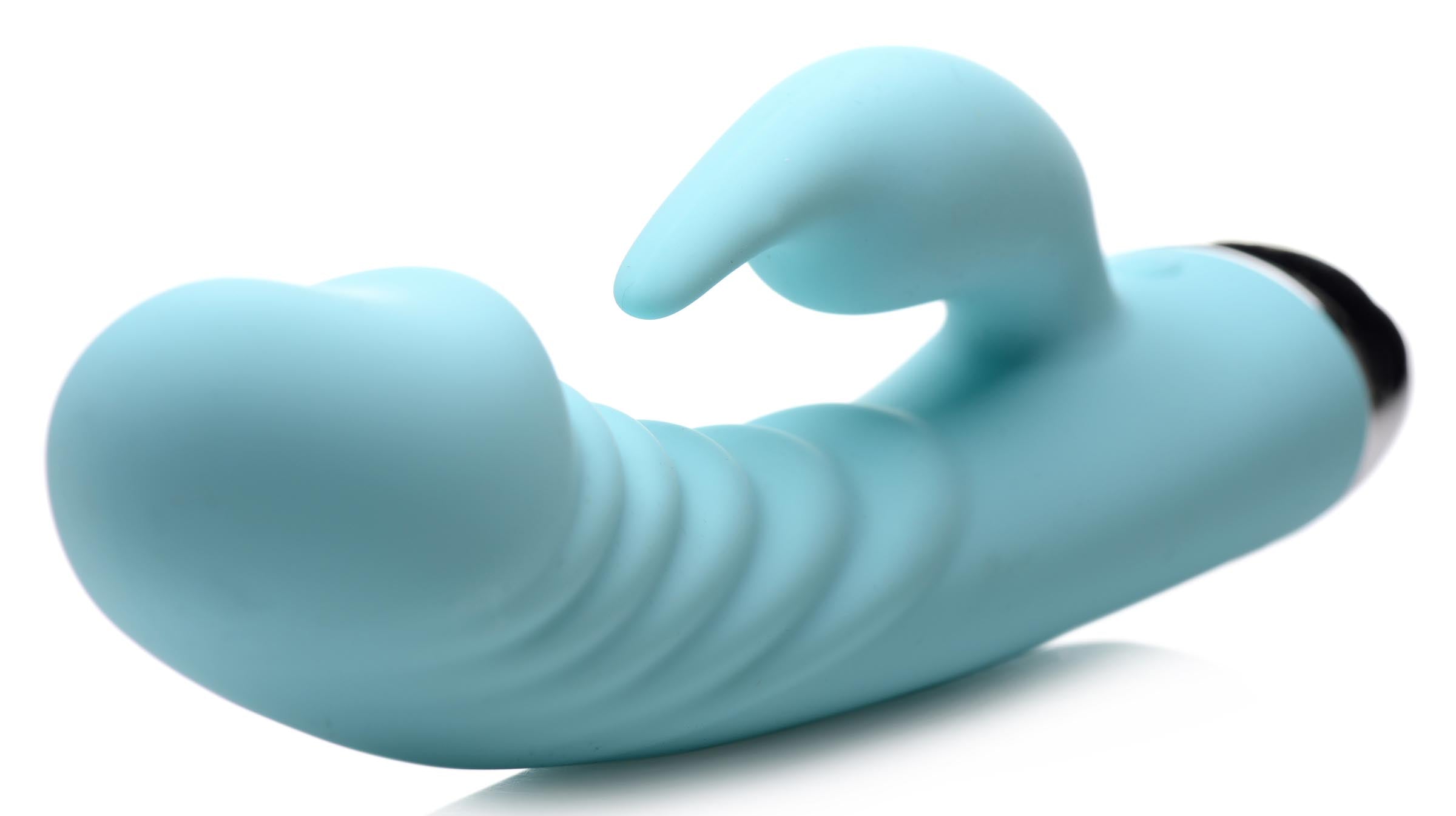 Sassy 10x Silicone G-spot Vibrator resting on a white surface, showcasing its design