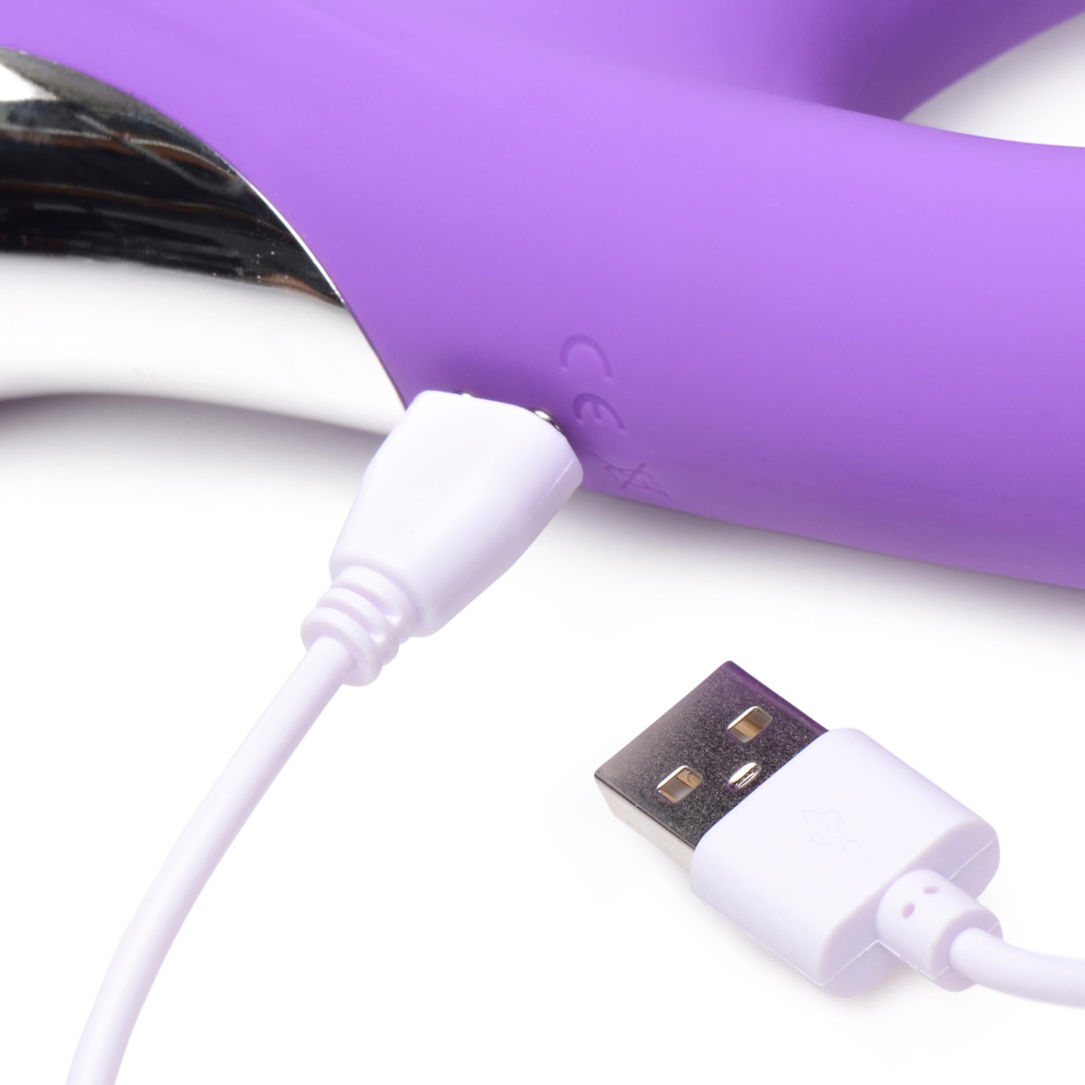 Close-up of the purple rabbit vibrator with a USB charging cable