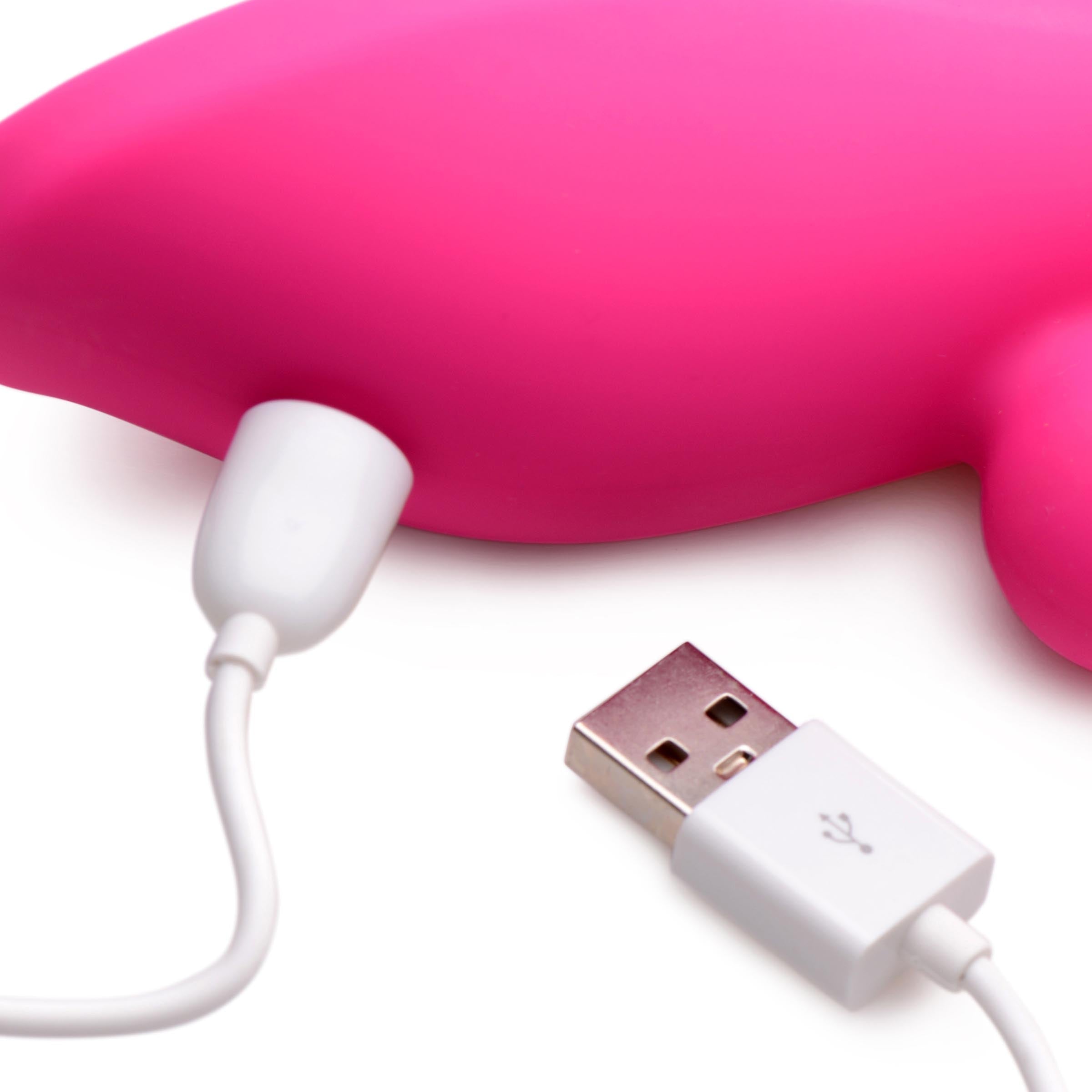 Pink Suckers 21x dolphin-shaped vibrator with USB charging cable