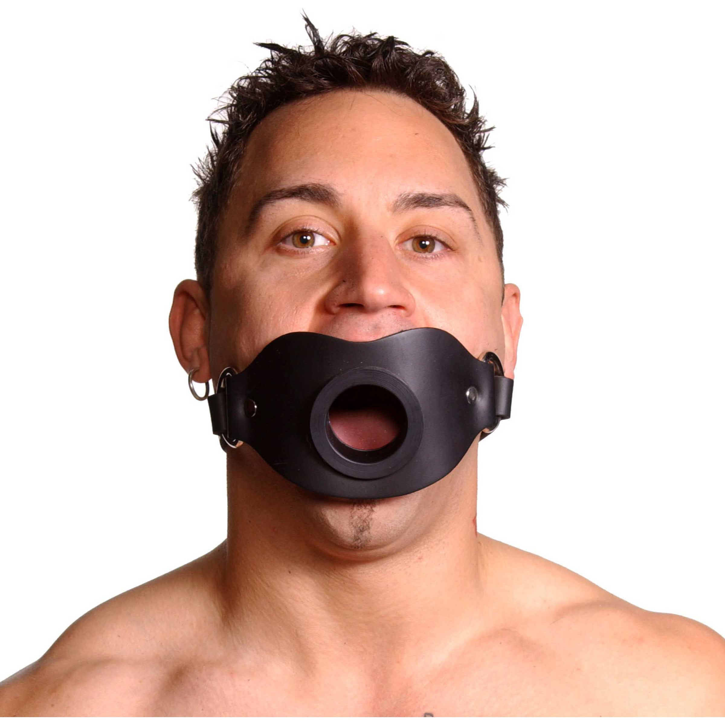 Person wearing a black open mouth gag with adjustable strap