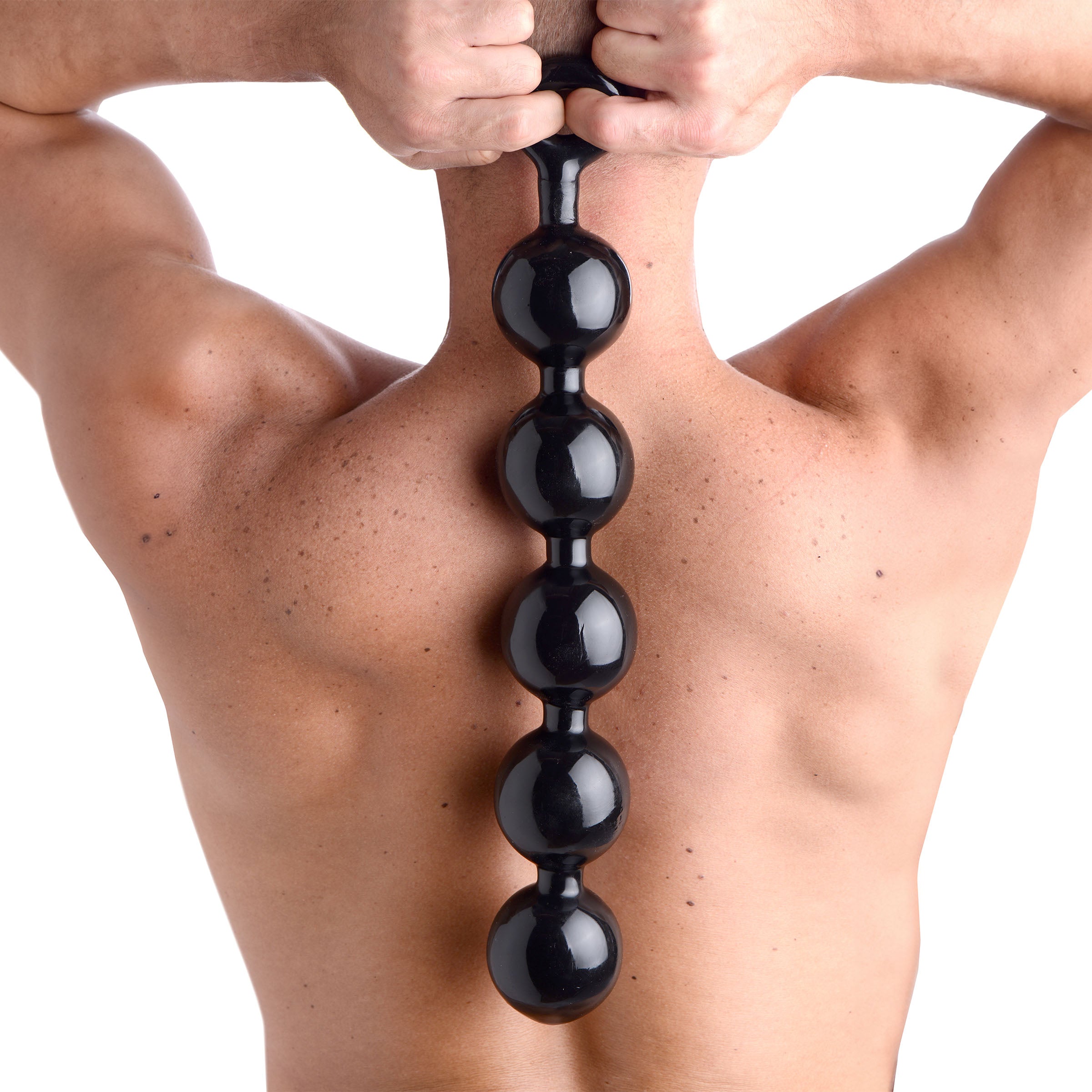 Person demonstrating the use of Black Baller Anal Beads