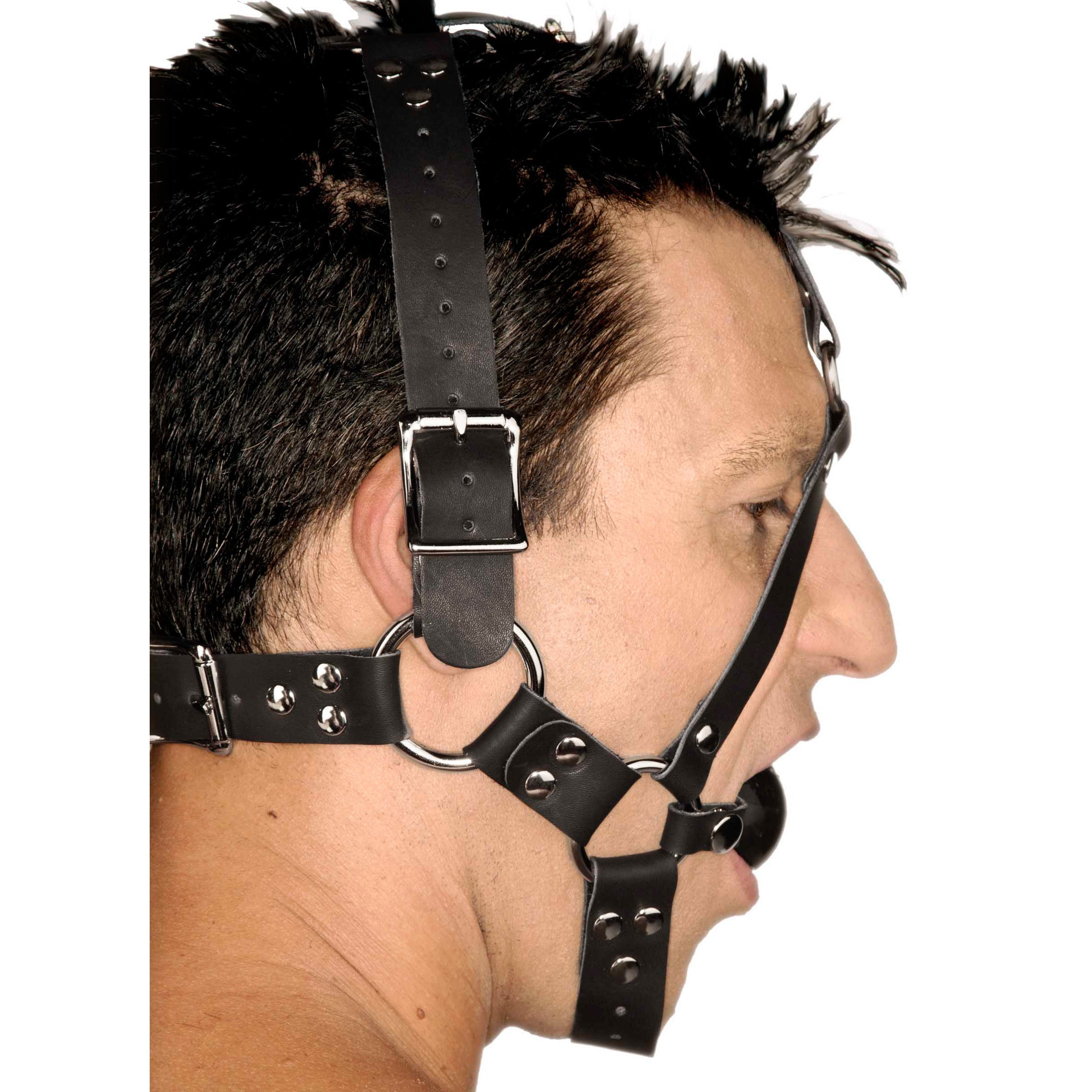 Leather ball gag harness displayed against a plain background