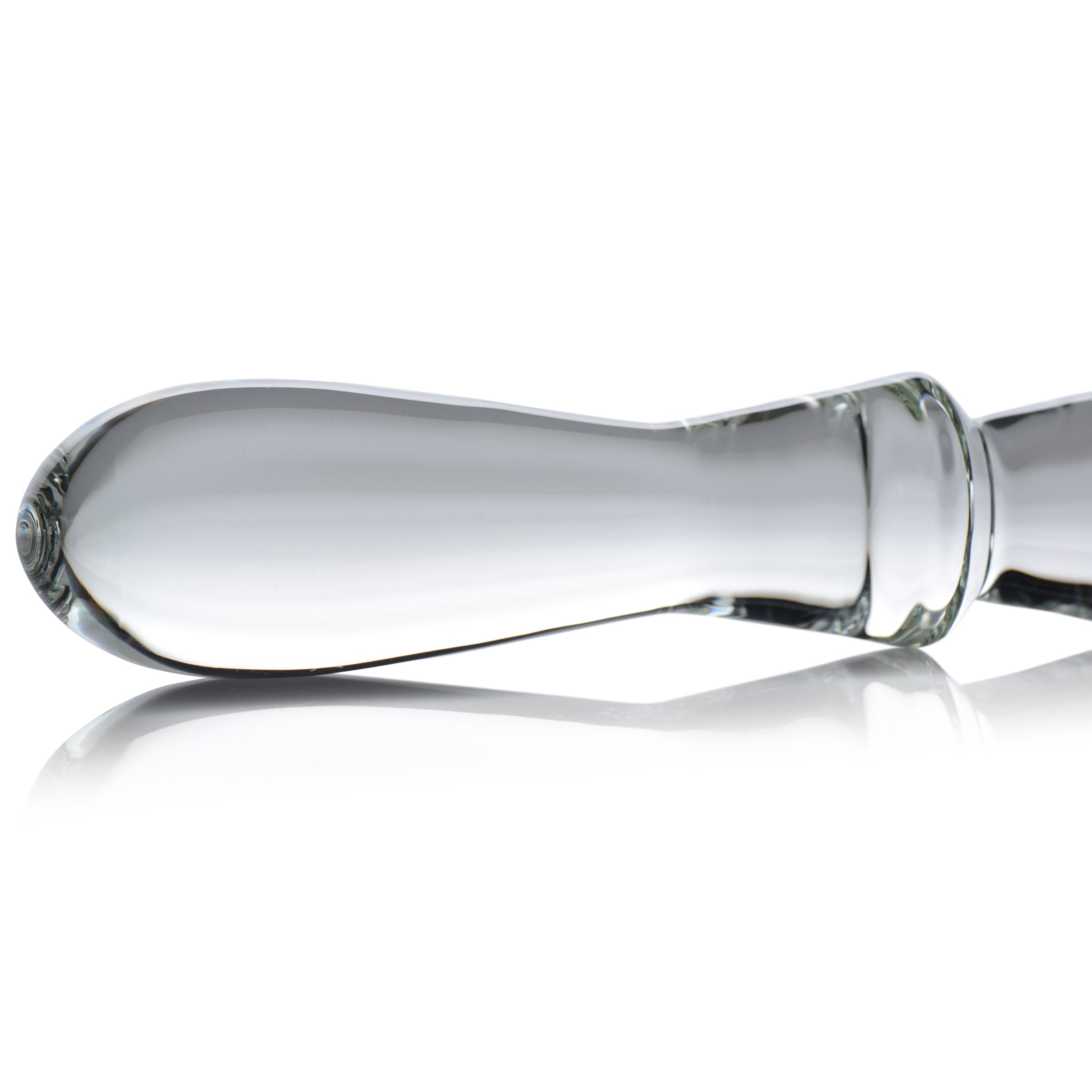 Sleek glass dildo with a smooth surface and white background